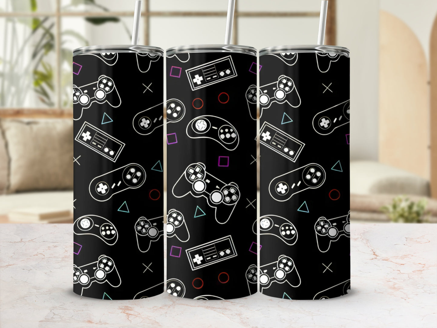 Black tumbler with repeating pattern of video game controllers and buttons.