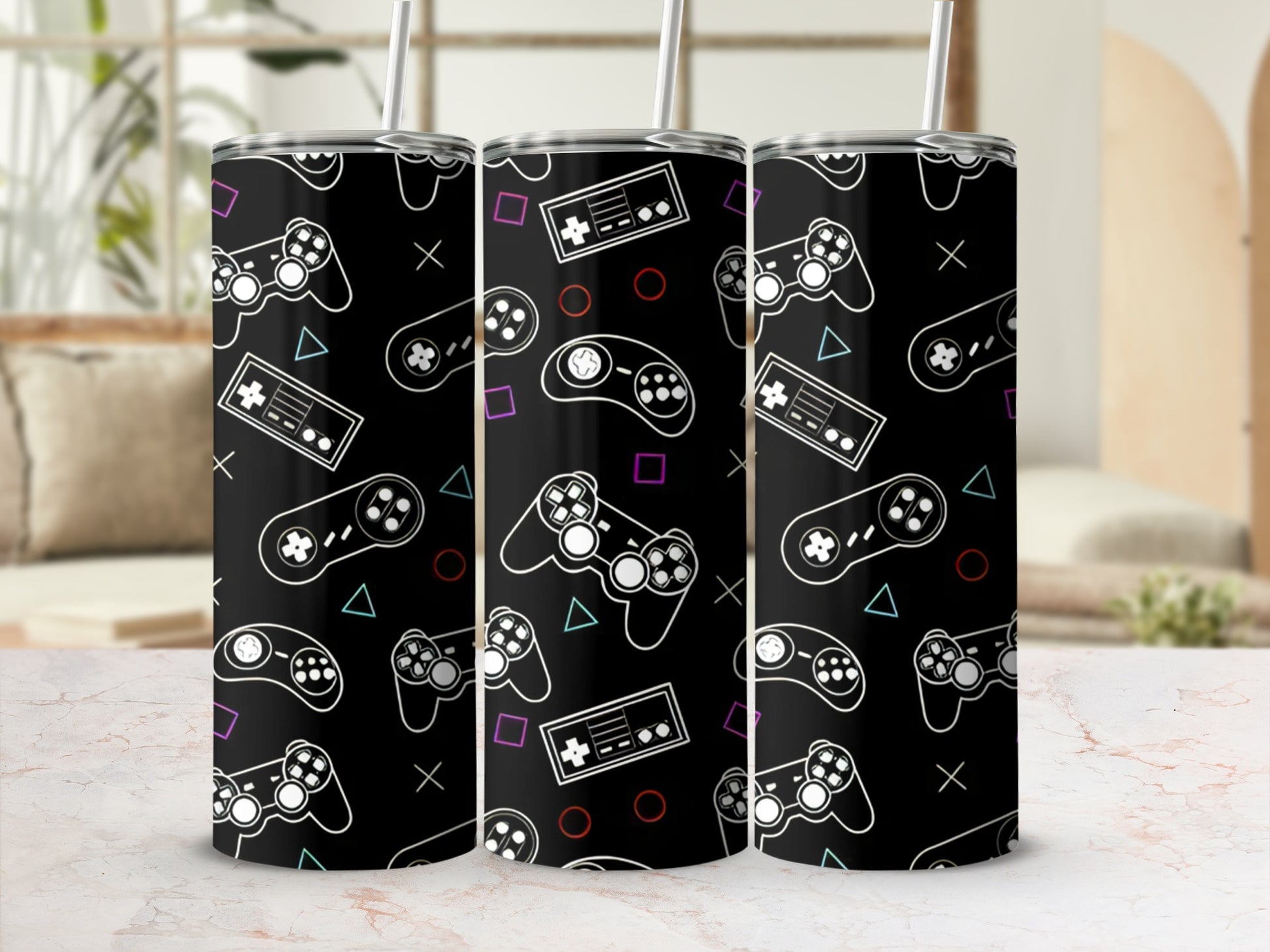 Black tumbler with repeating pattern of video game controllers and buttons.