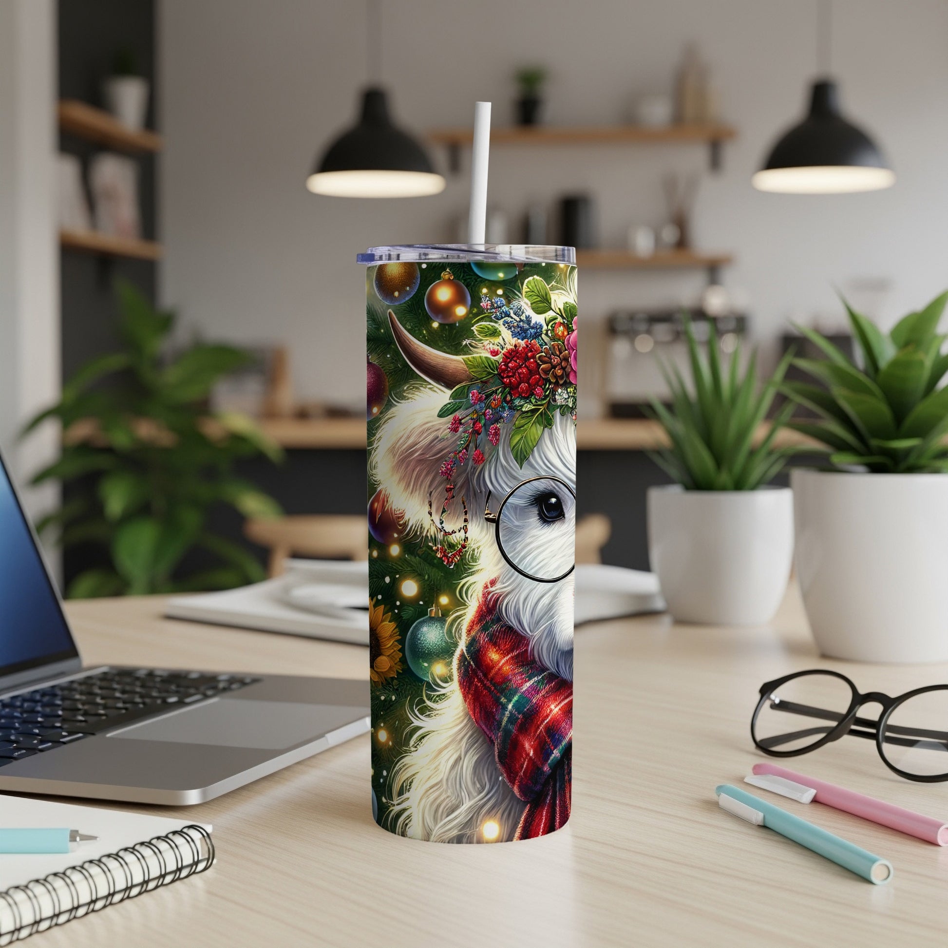 White Highland cow with festive wreath and plaid scarf on a tumbler.