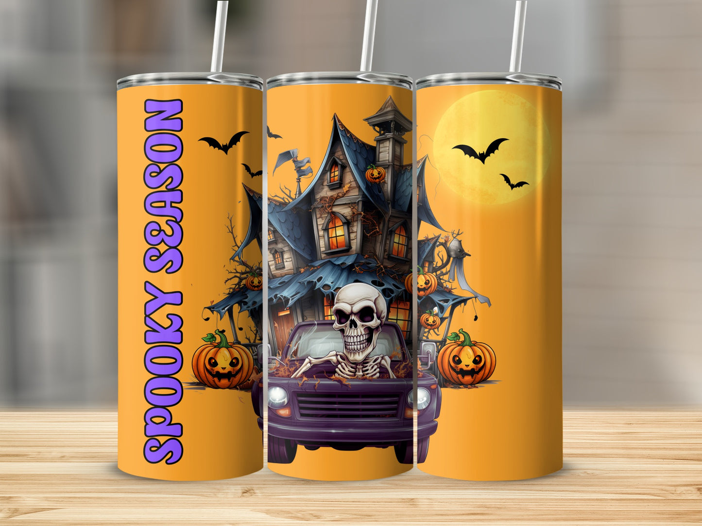 Halloween tumbler with skeleton driver, haunted house, pumpkins, bats, and "Spooky Season" text.