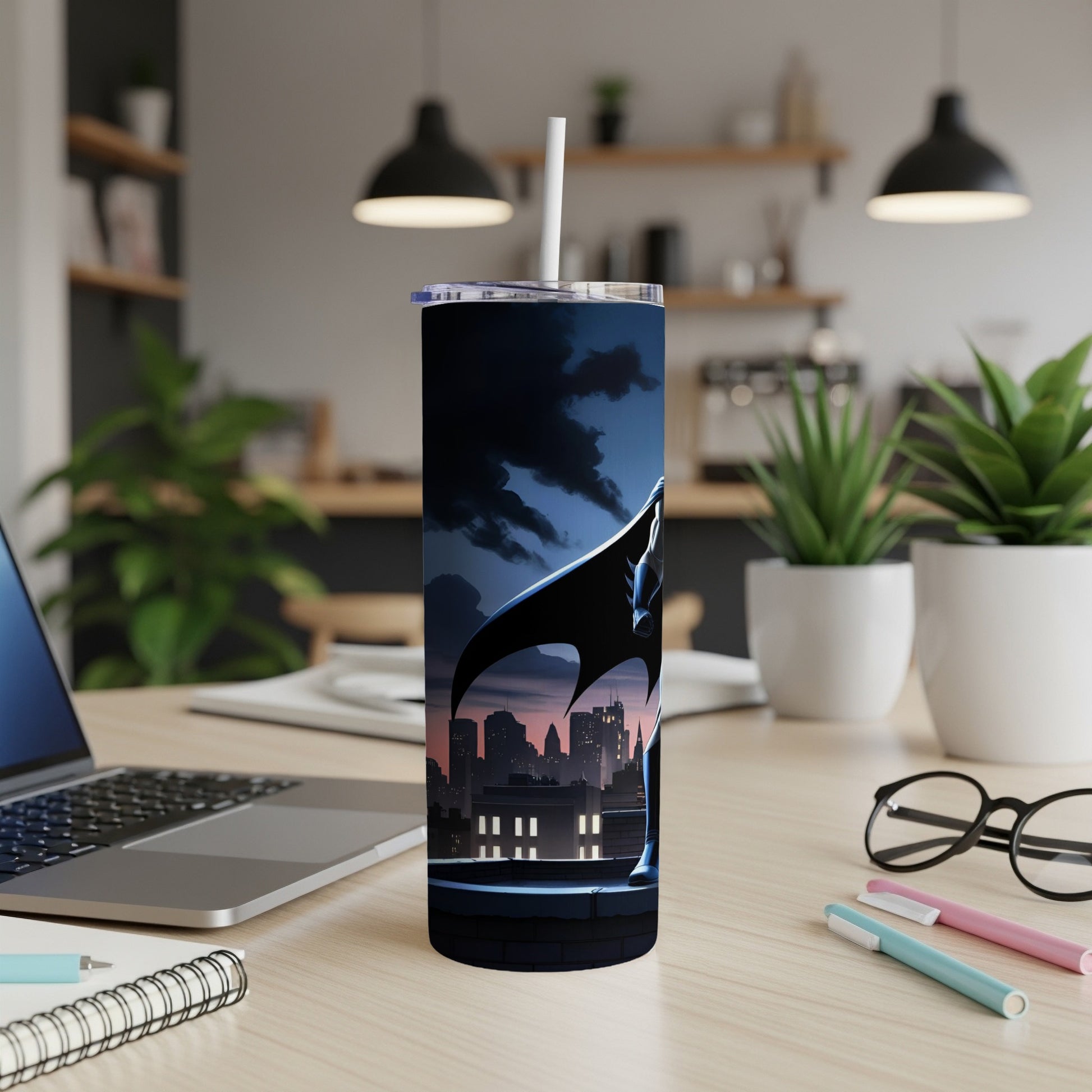 Batman perched on a rooftop overlooking a city skyline on a blue tumbler.