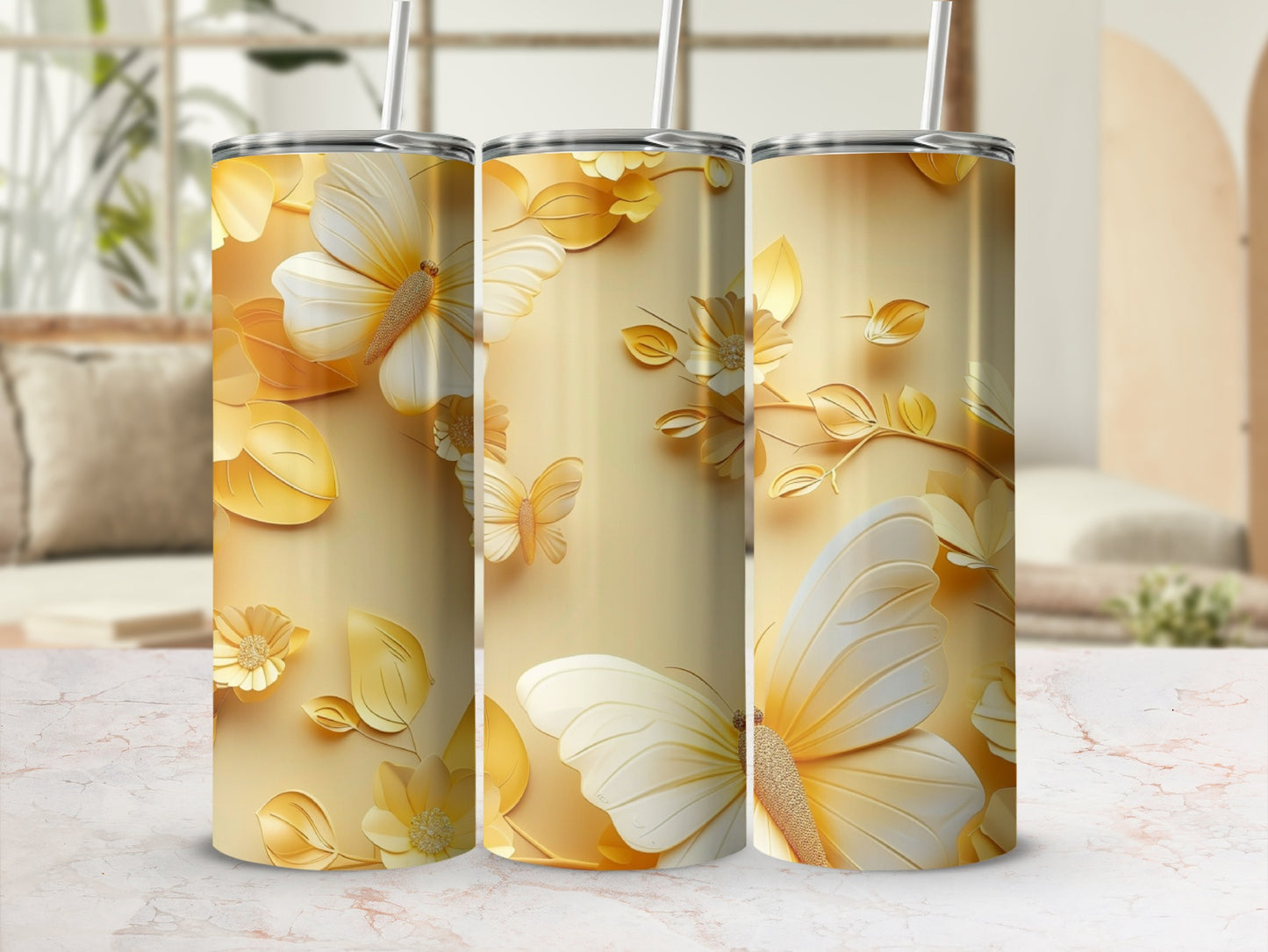 Three golden tumblers featuring a butterfly and floral design.