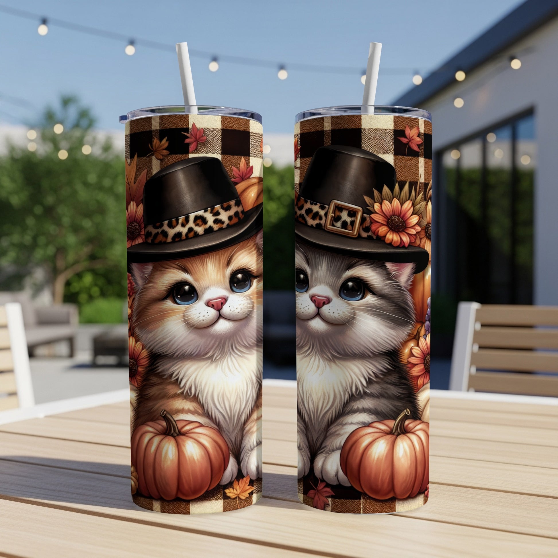 Two tumblers with cartoon cats in pilgrim hats and pumpkins, on a table.