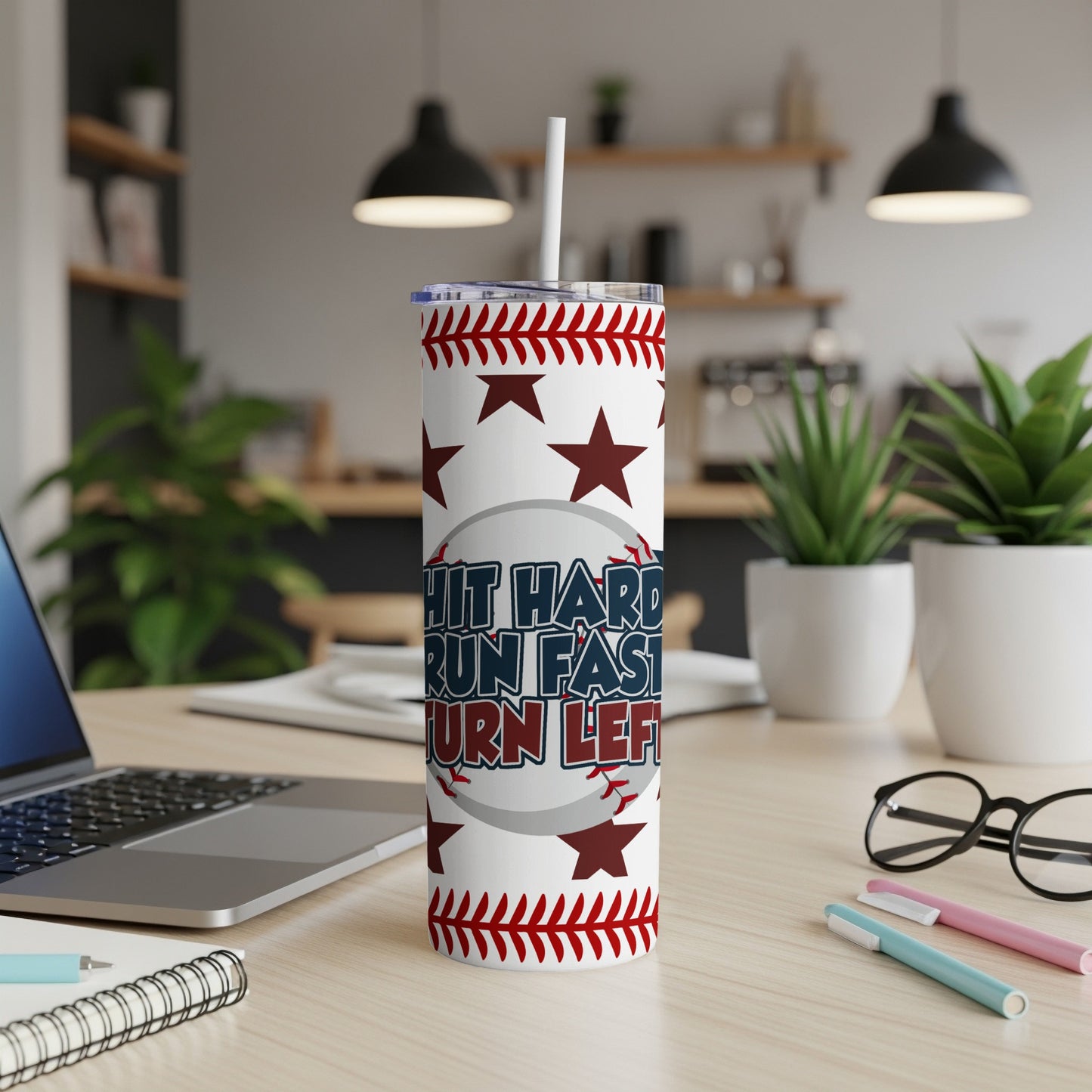 White tumbler with red stars and baseball stitching, reads "Hustle Hard, Run Fast, Turn Left".
