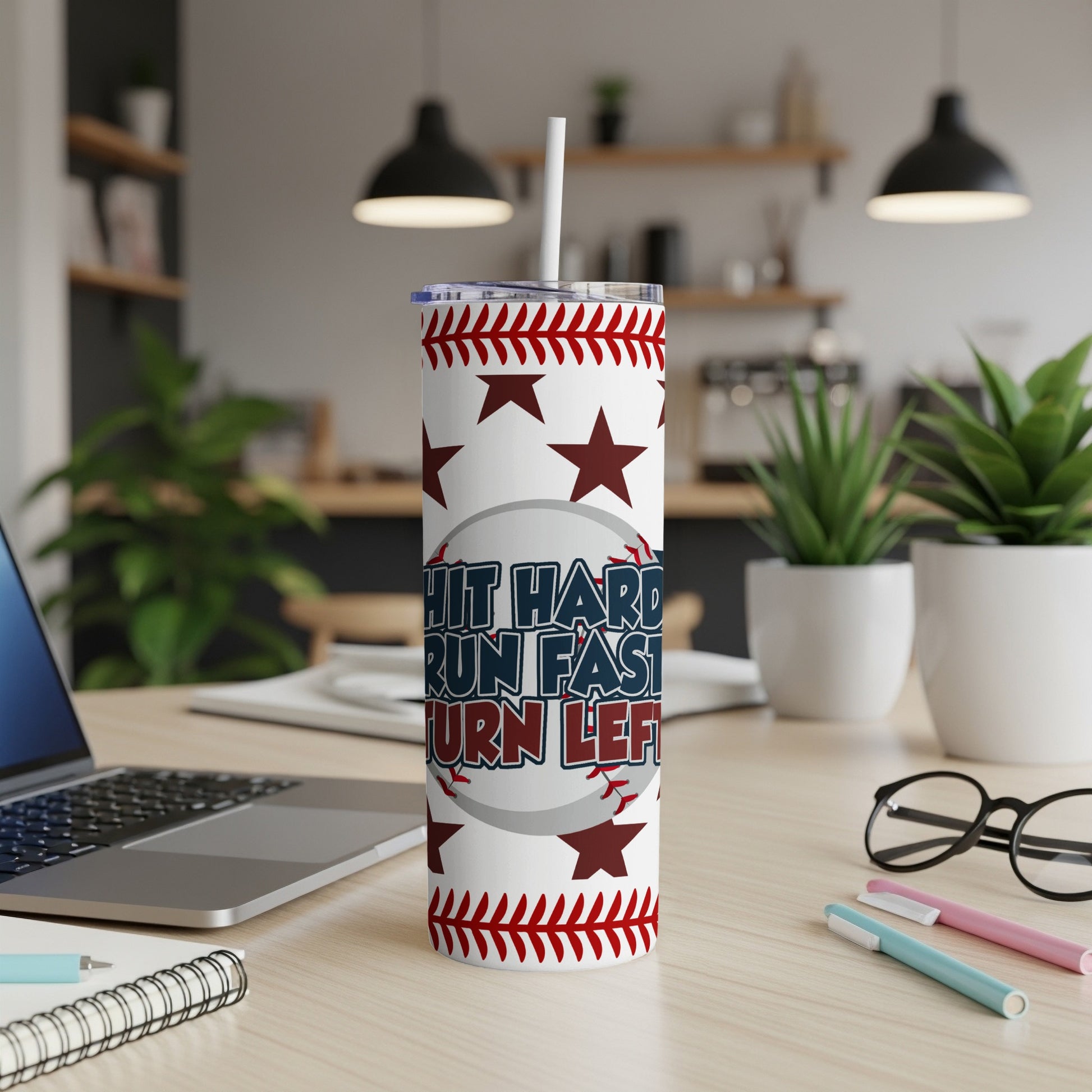 White tumbler with red stars and baseball stitching, reads "Hustle Hard, Run Fast, Turn Left".
