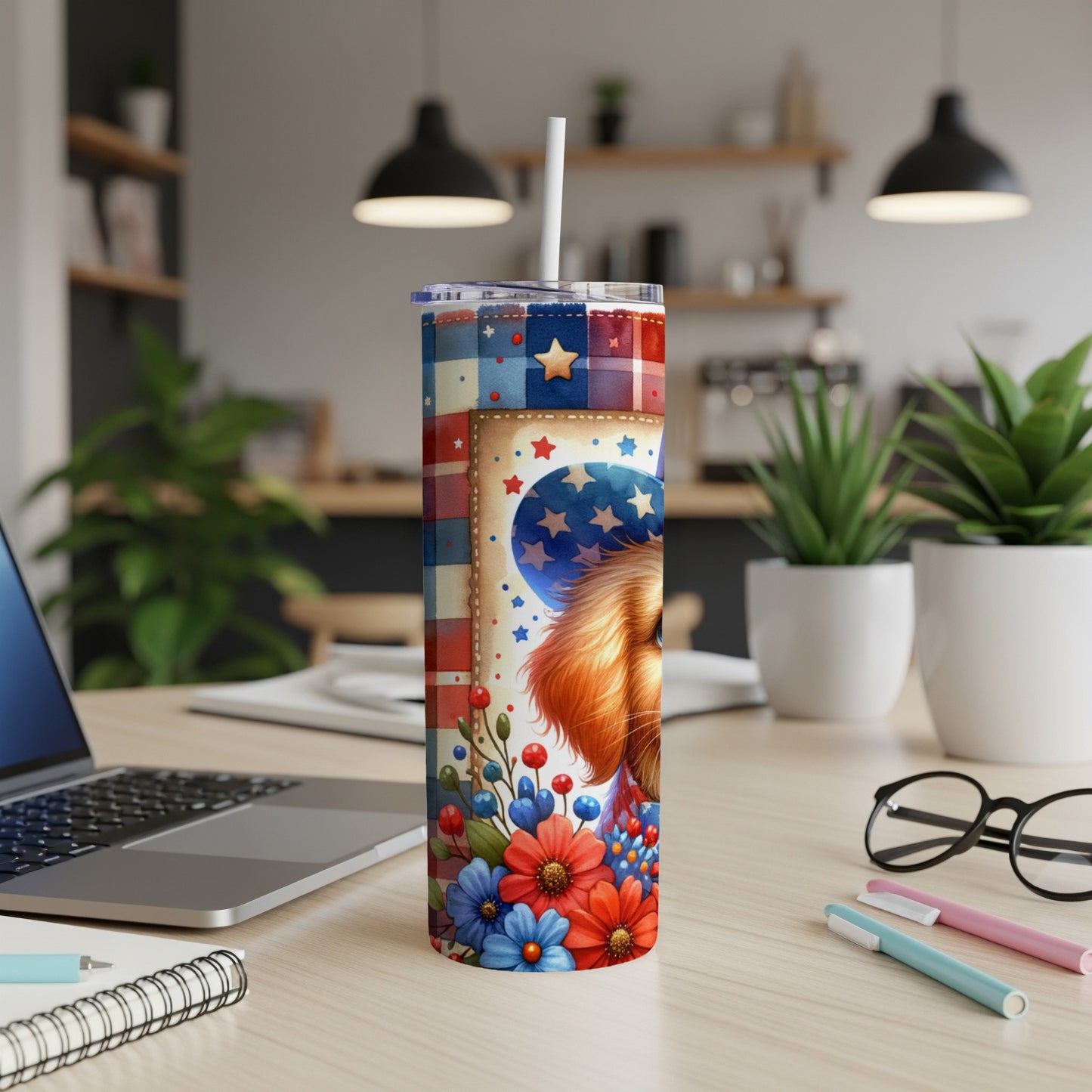 Patriotic dog tumbler with American flag pattern, flowers, and straw.