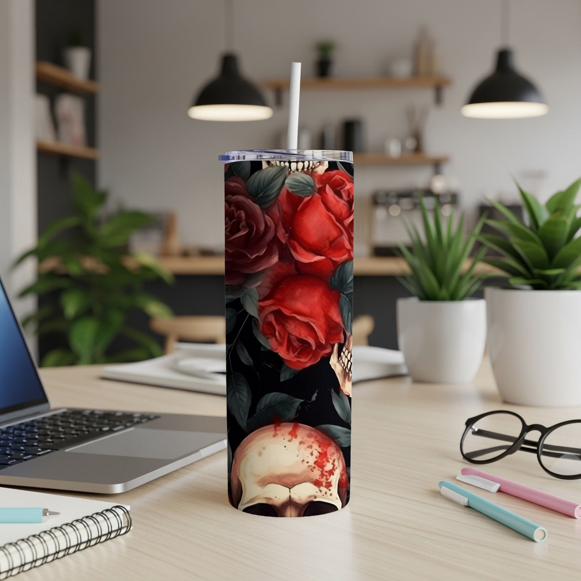 Tall tumbler with roses and a skull design.