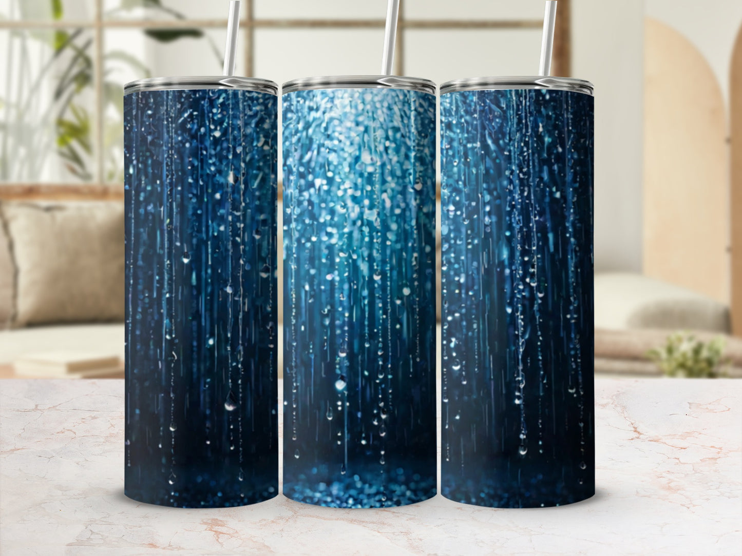 Three tumblers with a blue glittery raindrop pattern.