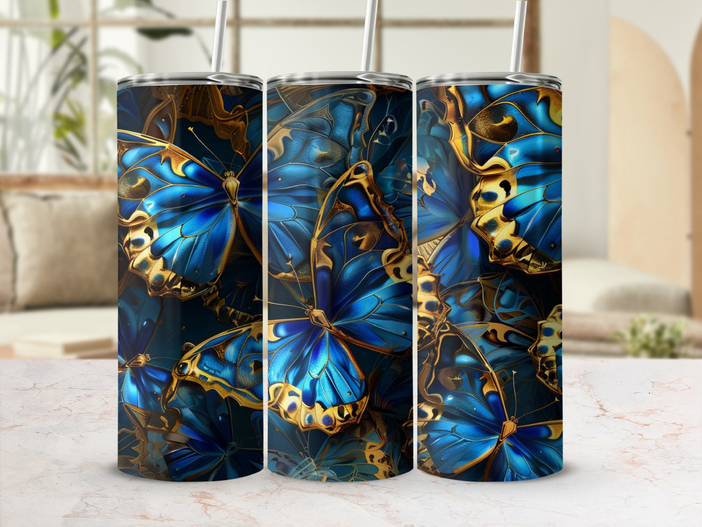 Three tumblers with a close-up blue and gold butterfly pattern.