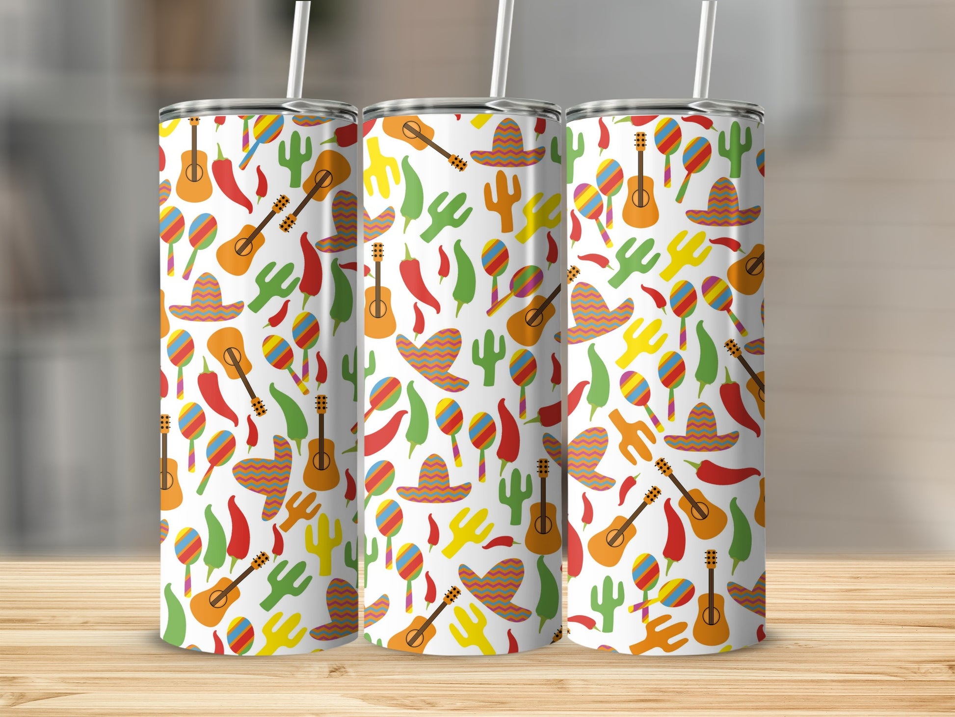 Three tumblers with a pattern of guitars, sombreros, maracas, cacti, and peppers.