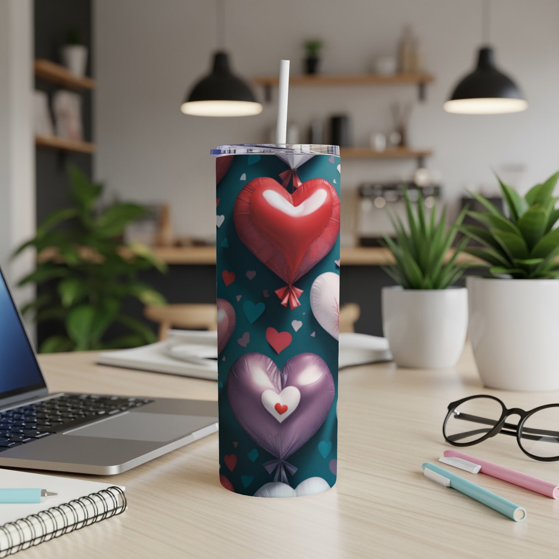 Dark tumbler with a pattern of red and pink heart-shaped balloons.