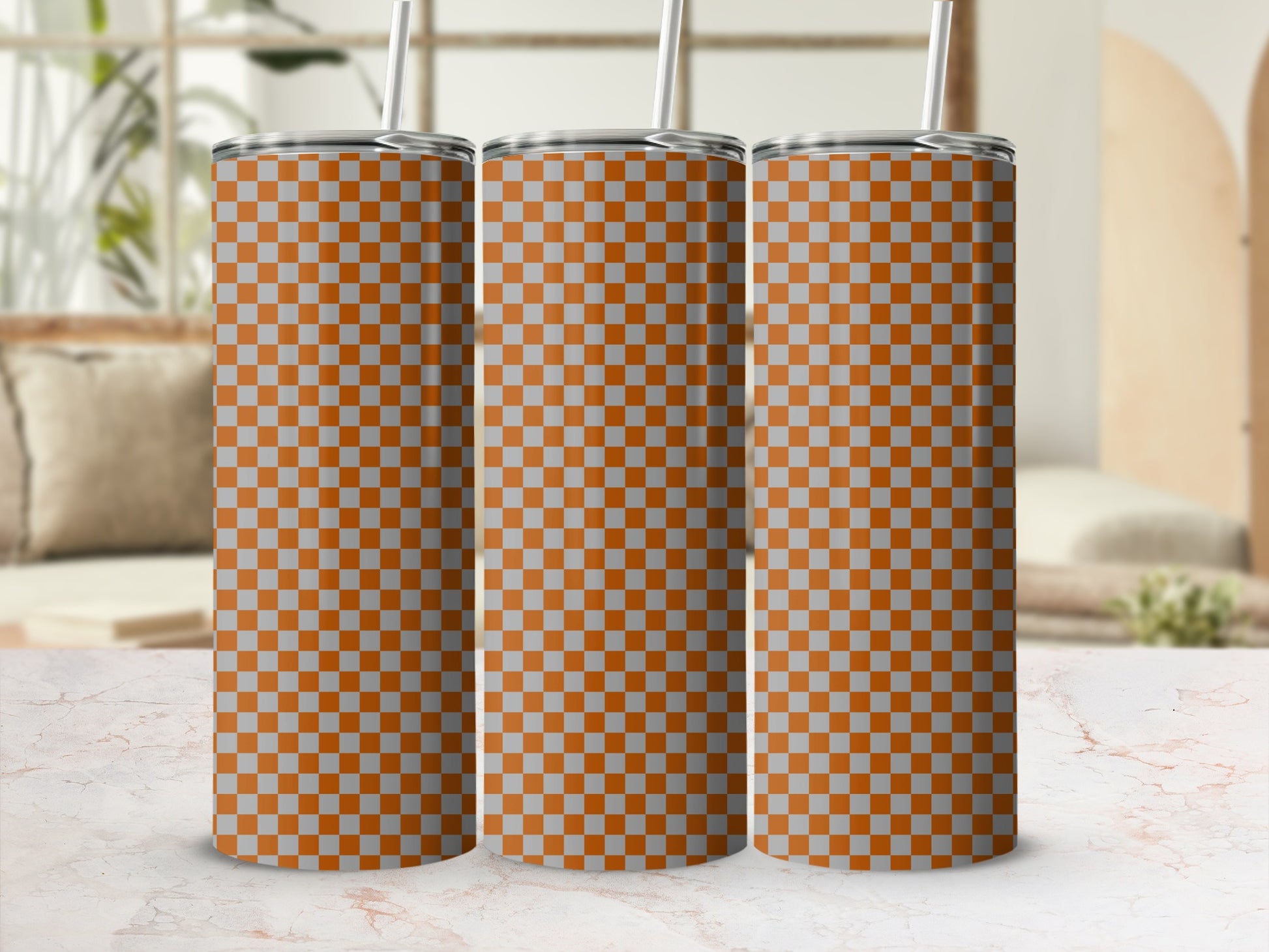 Three tumblers with orange and gray checkerboard pattern.