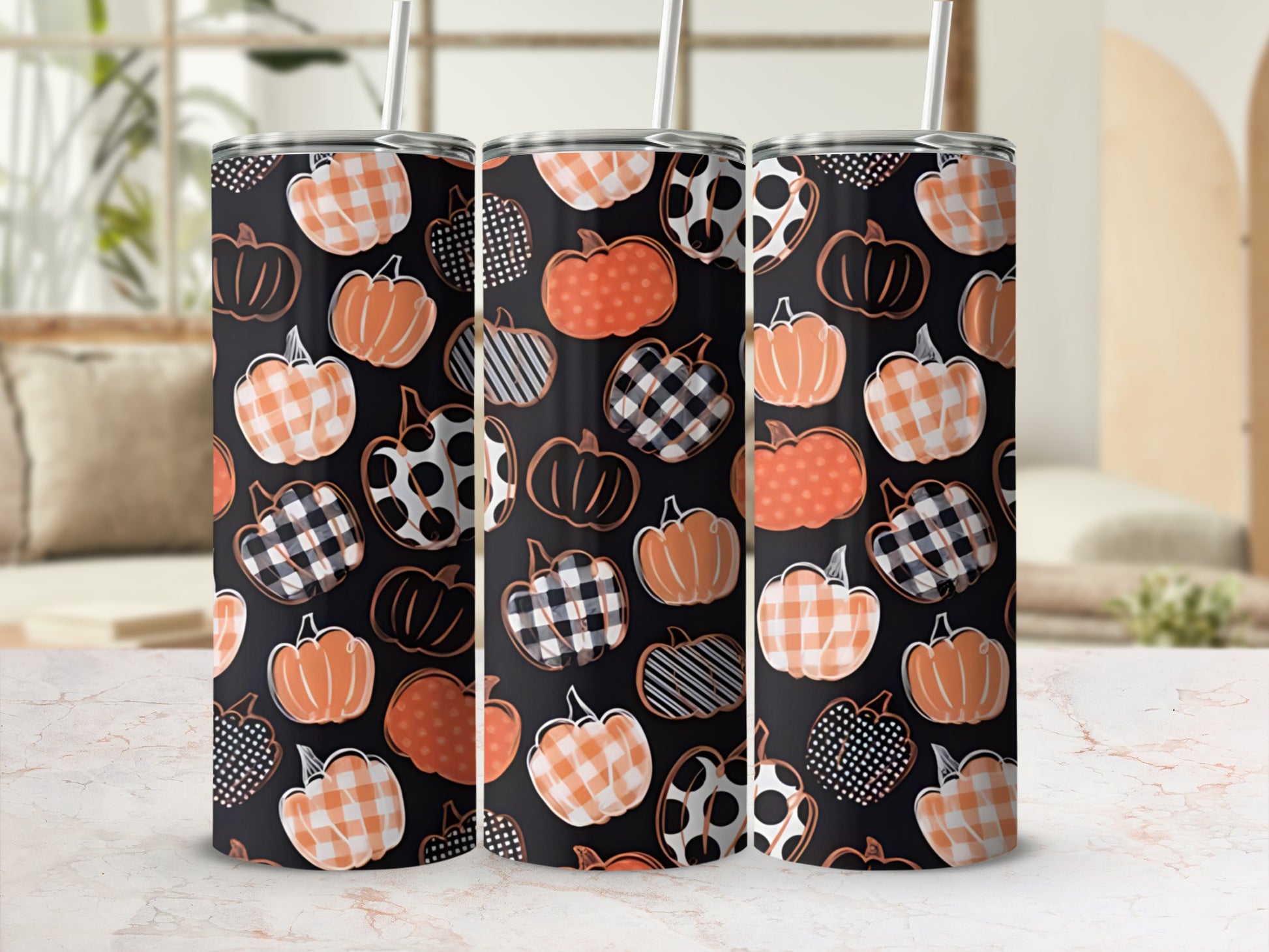 Three tumblers with various pumpkin patterns: plaid, polka dots, and solid orange.