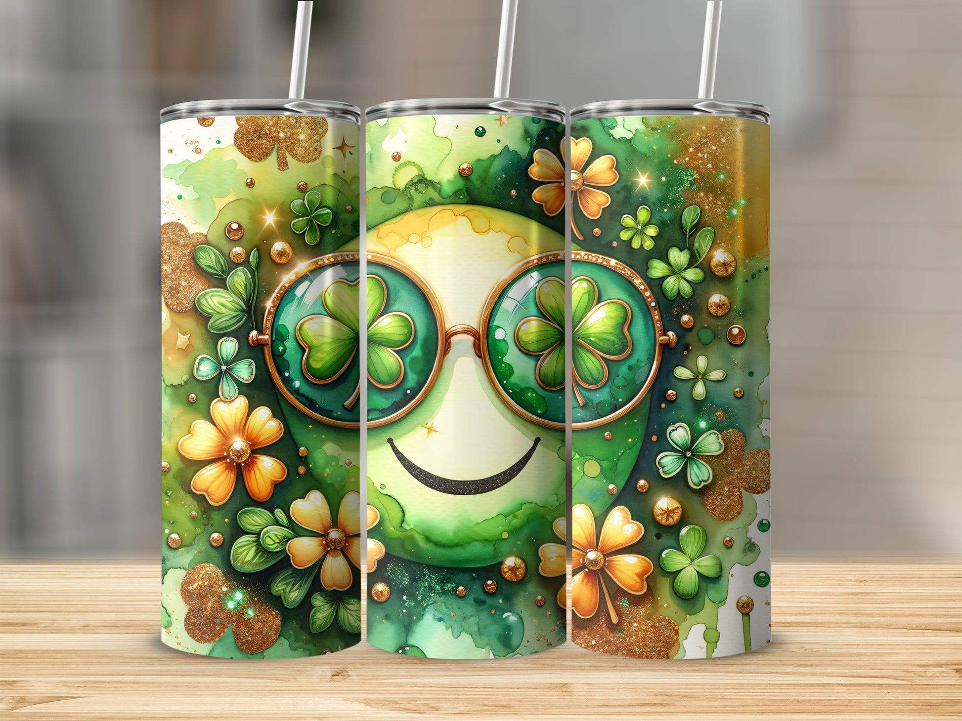 Three tumblers with a smiling green face wearing shamrock sunglasses.