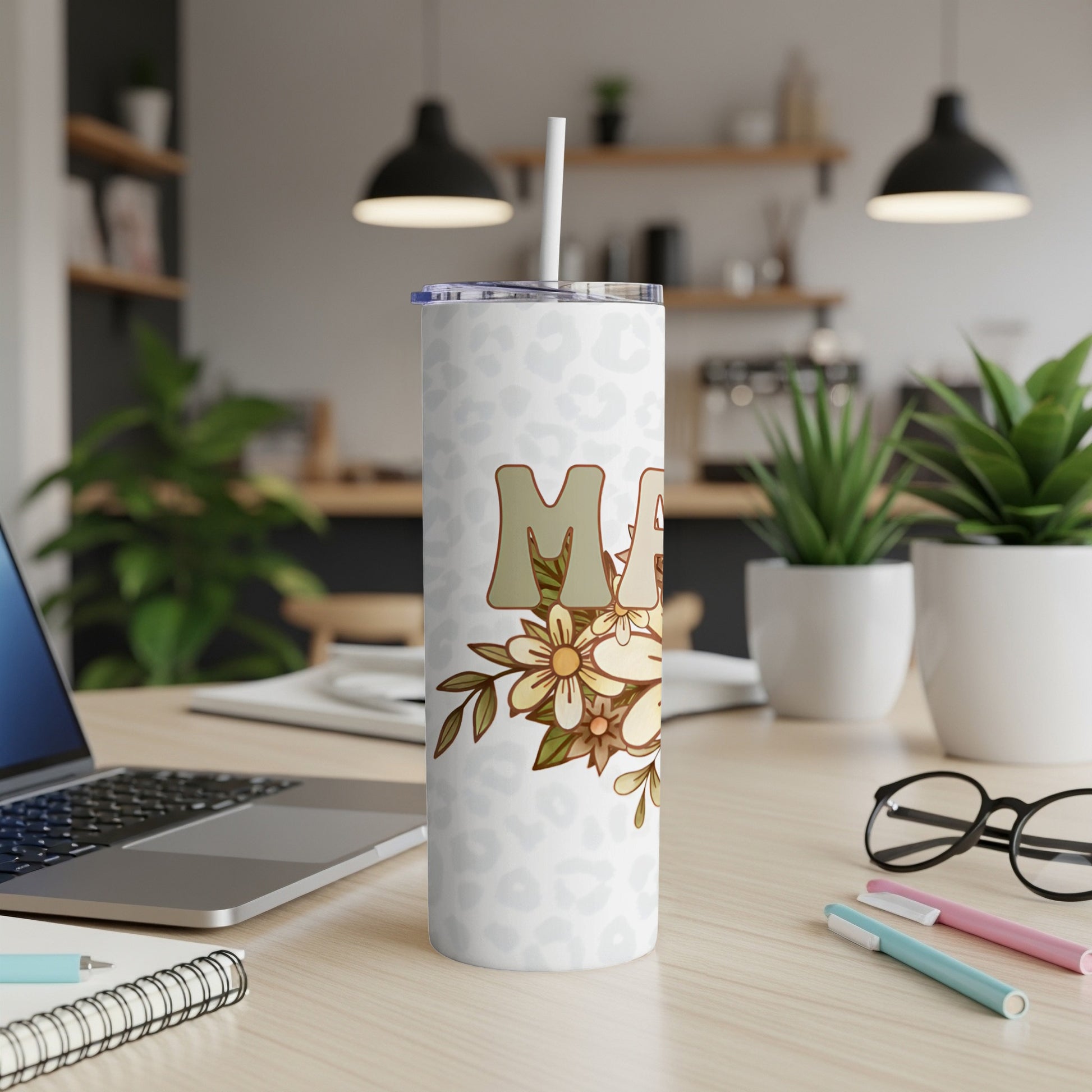 White tumbler with floral "Mama" text and leopard print accents.