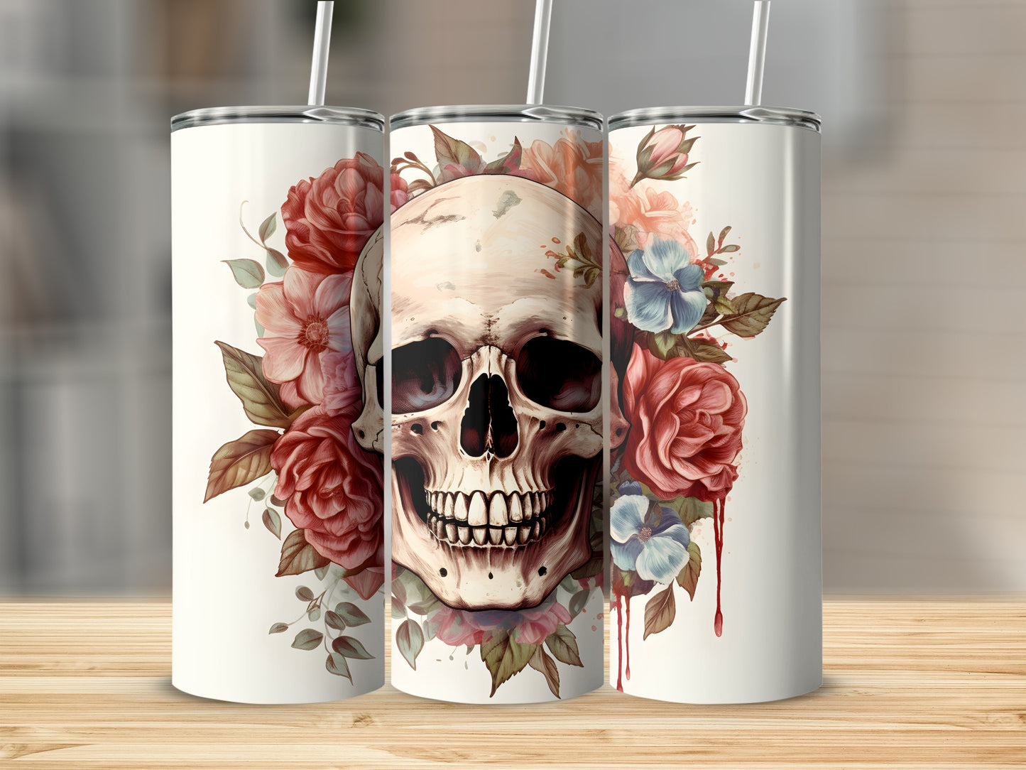 Floral skull tumbler with red and blue flowers on a wooden surface.