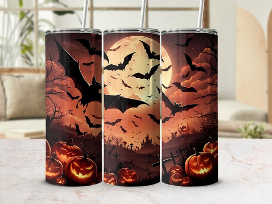 Three tumblers with Halloween designs featuring bats, pumpkins, and a full moon.