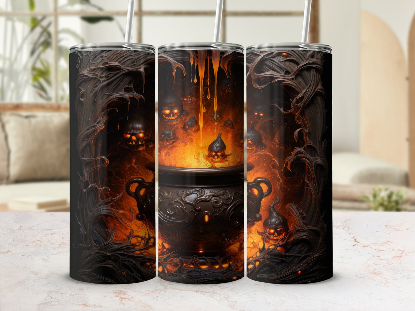 Three tumblers with a dark, fiery cauldron and grinning skull design.