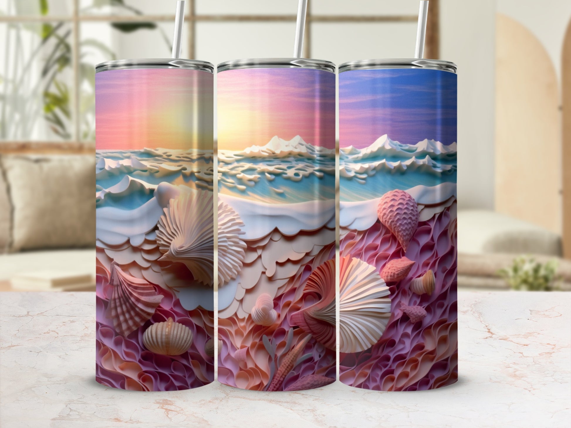 Three tumblers with a sunset ocean and seashell design.
