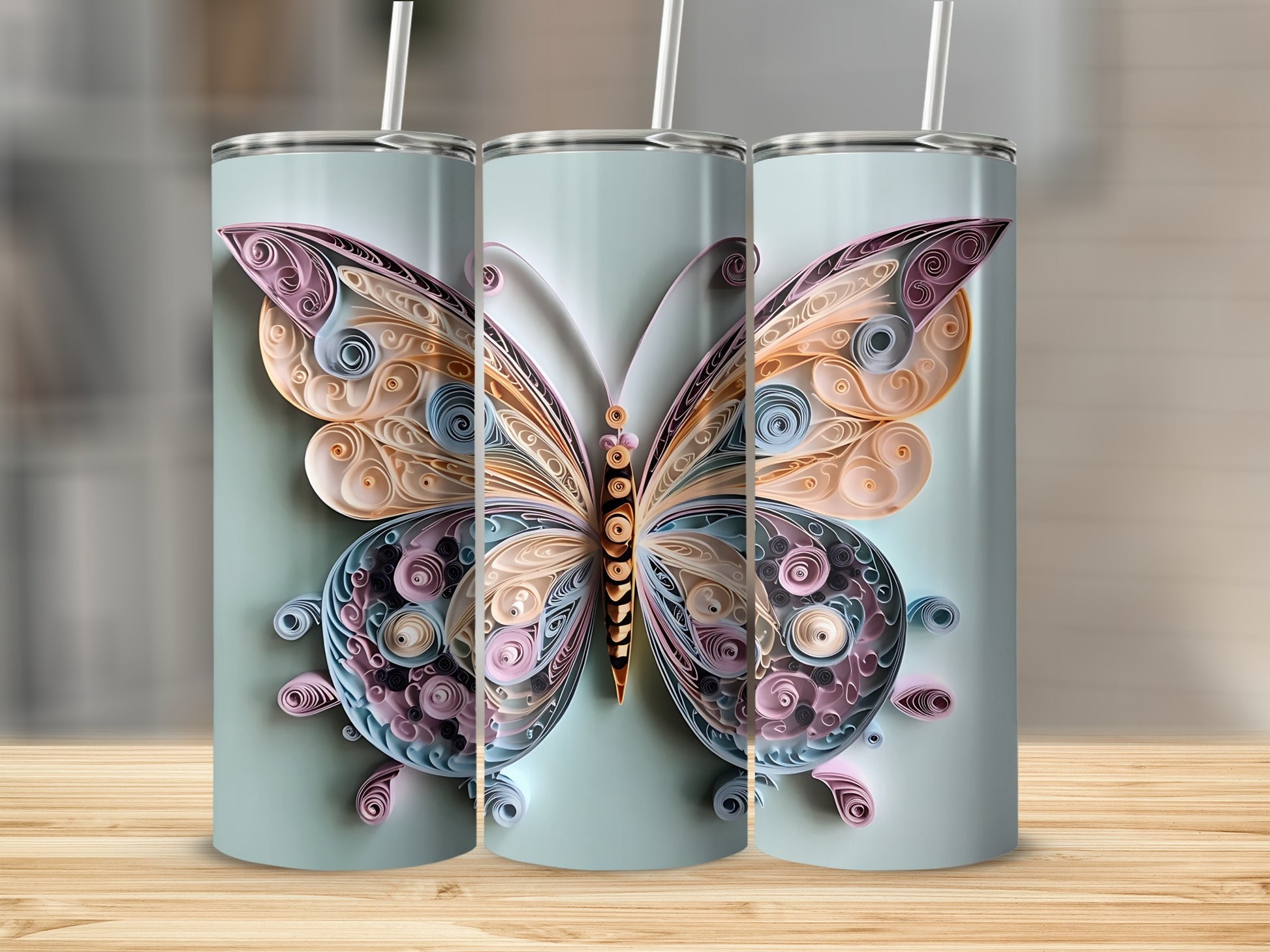 Three tumblers featuring a delicate quilled paper butterfly design in pastel colors.