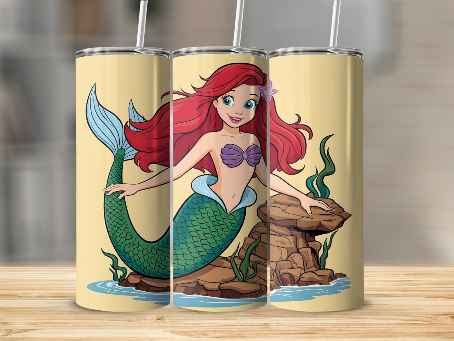 Ariel the mermaid sits on rocks in this illustration.
