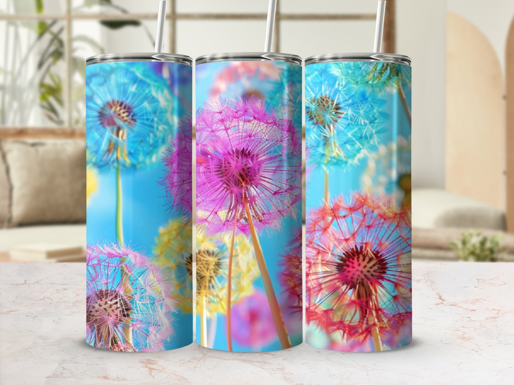 Three tumblers featuring colorful dandelion seeds against a bright blue background.