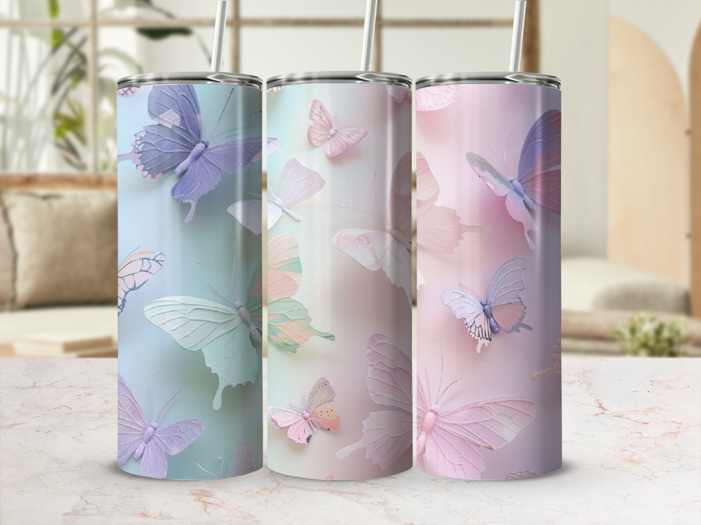 Three pastel tumblers with delicate butterfly designs.