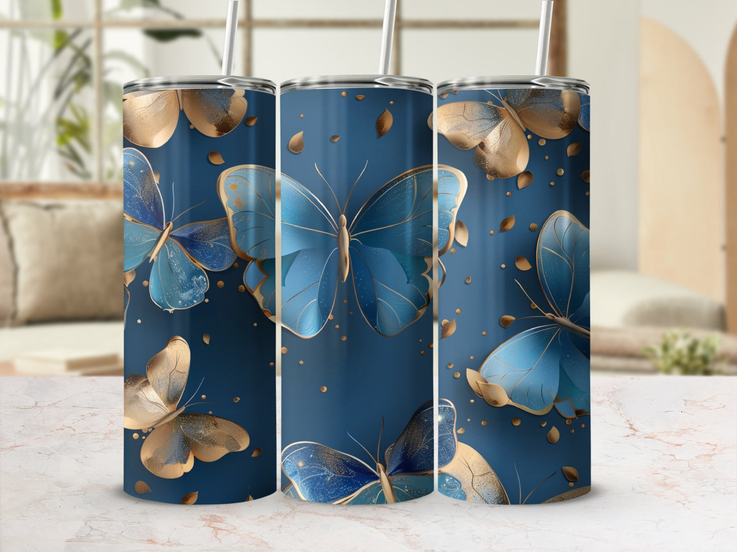 Blue and gold butterflies on a dark blue tumbler with a marble background.