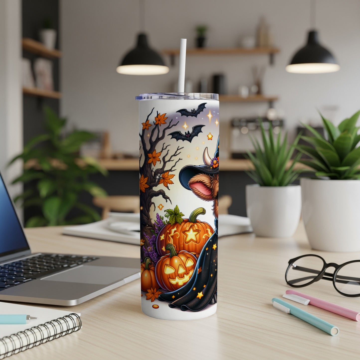 Halloween-themed tumbler with a cow in a witch hat and bats.