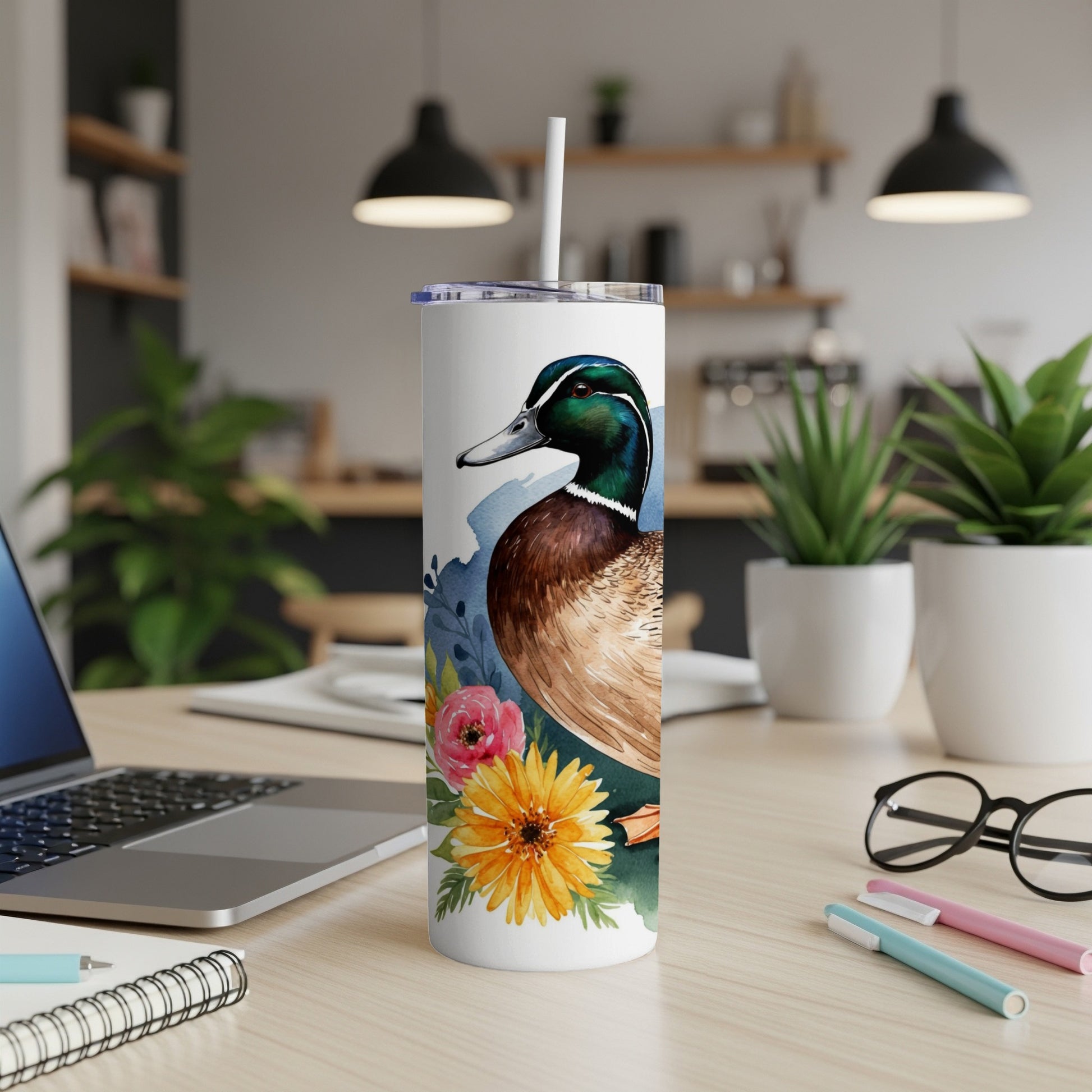 White tumbler with a mallard duck and floral watercolor design.