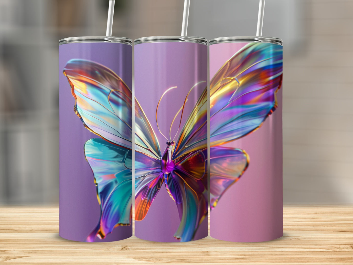 Three iridescent butterfly tumblers on a wooden surface with blurred background.