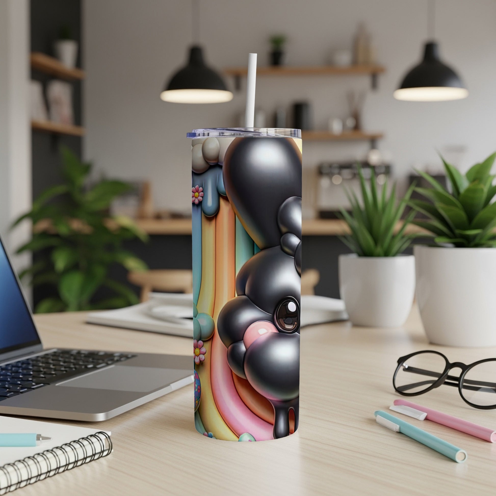 Black and pastel rainbow bubbly cartoon character on a white tumbler.