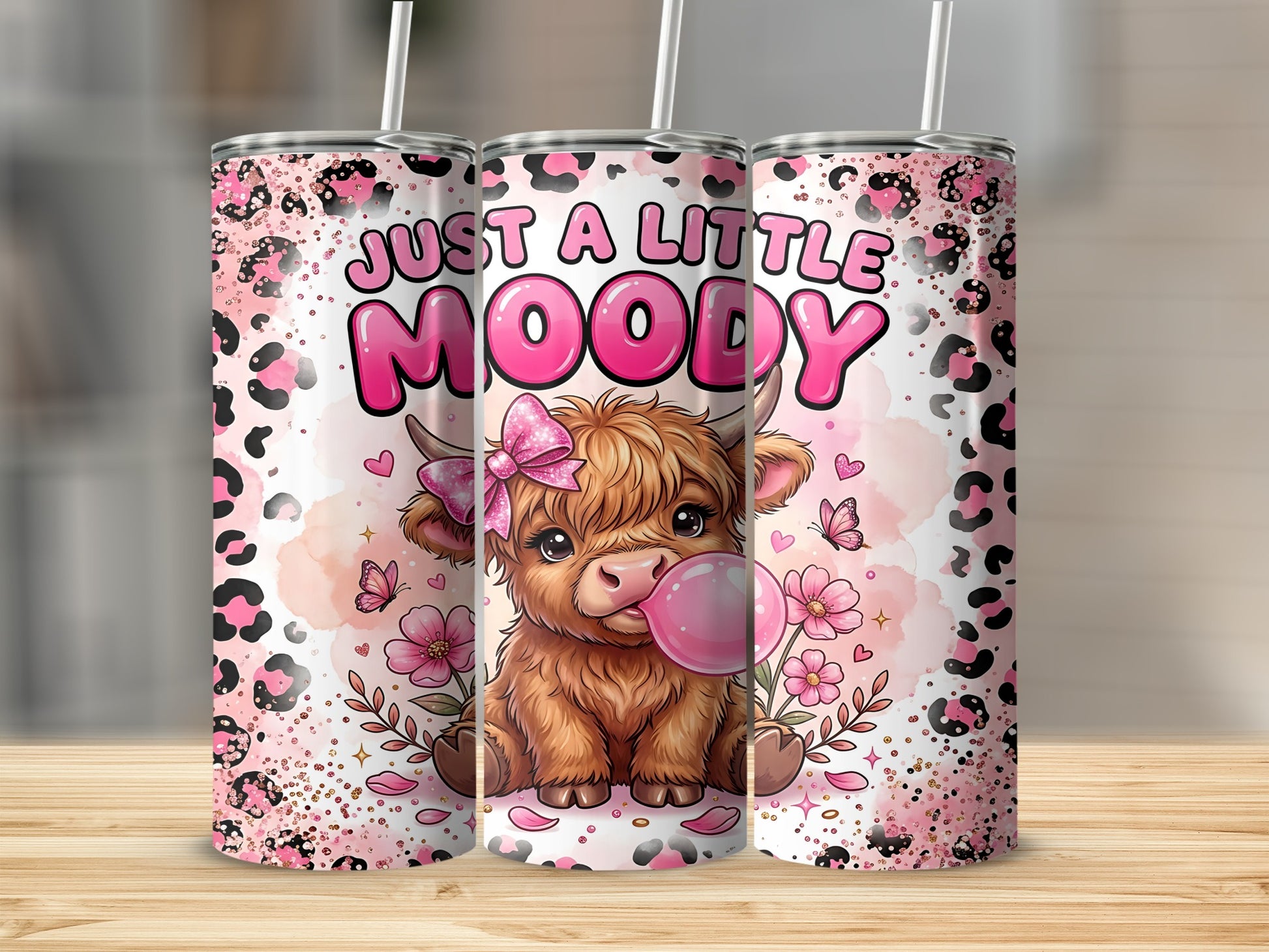 Highland cow with pink bubblegum, butterflies, and leopard print.