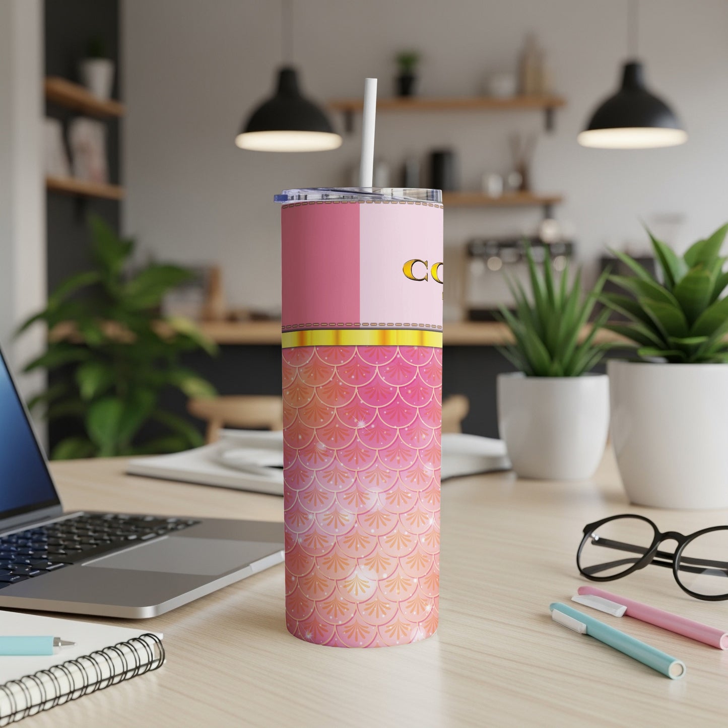 Pink and orange mermaid scale tumbler with "coo" text and straw.