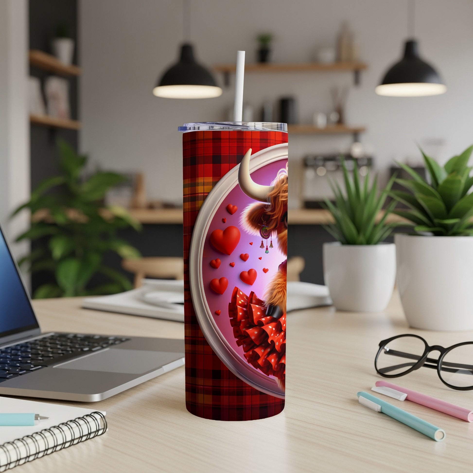 Scottish Highland cow in plaid heart frame on insulated tumbler.