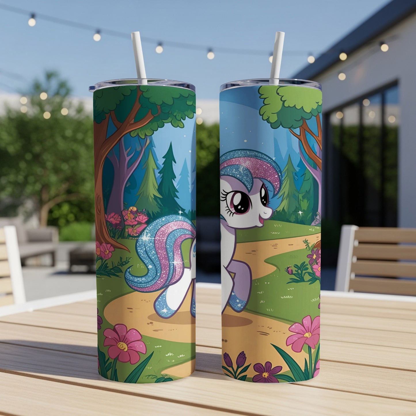 Unicorn illustration on a tall cylindrical tumbler with straw.