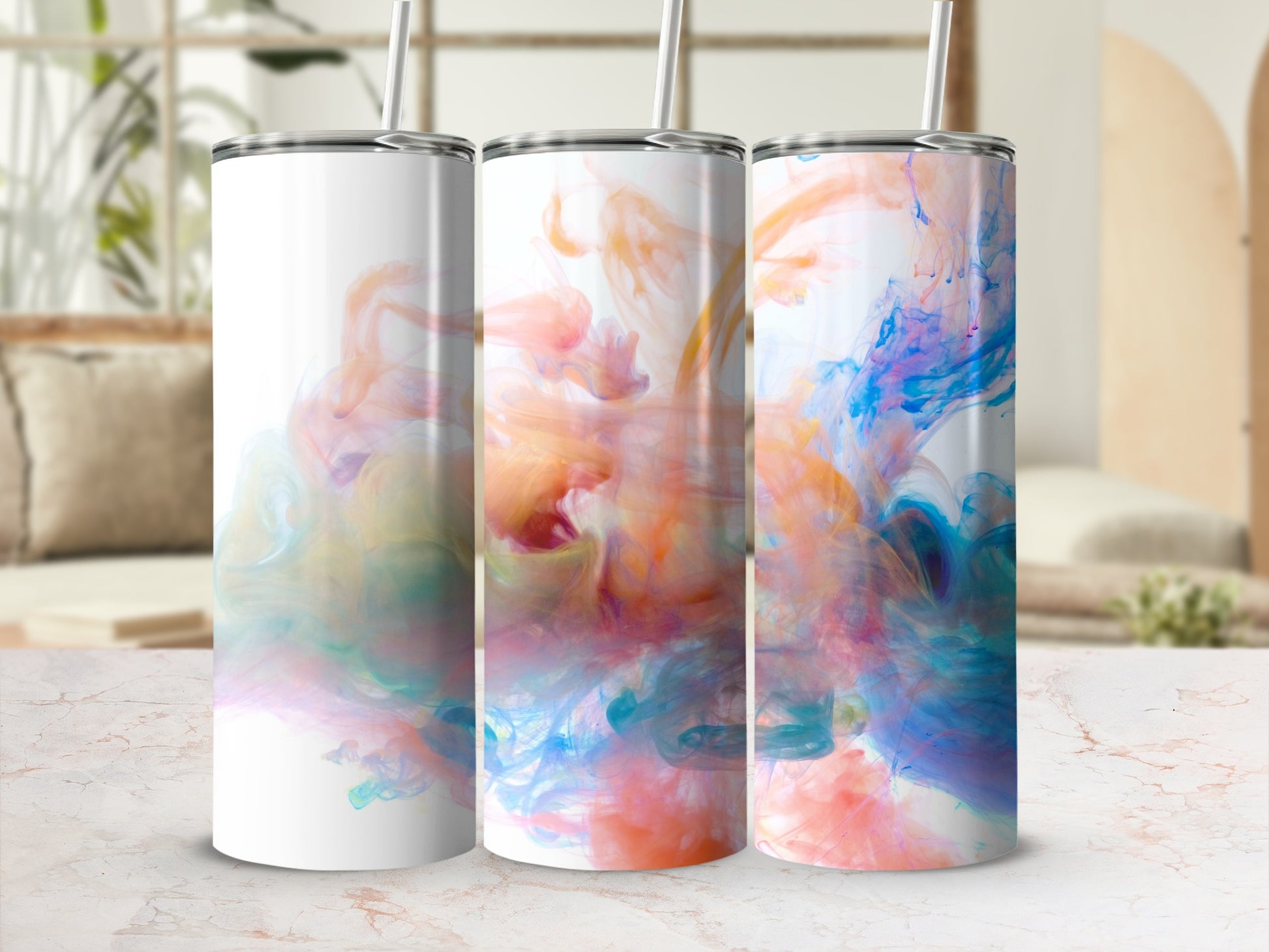 Three tumblers with colorful abstract watercolor designs.