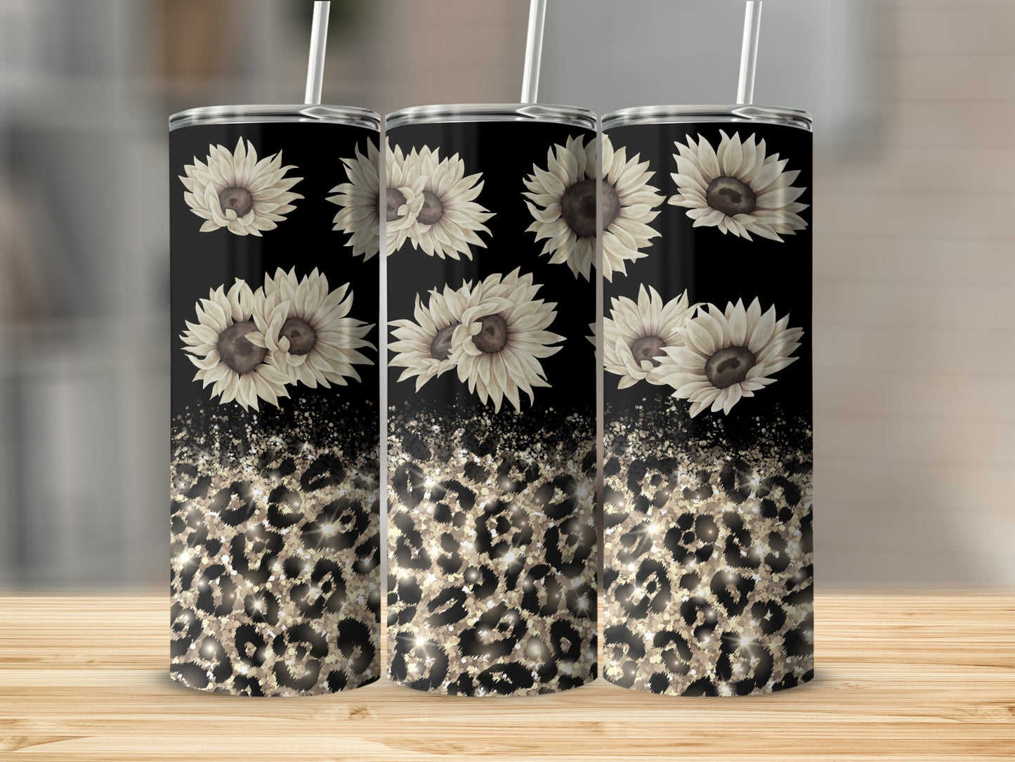 Three tumblers with sunflowers and leopard print designs.