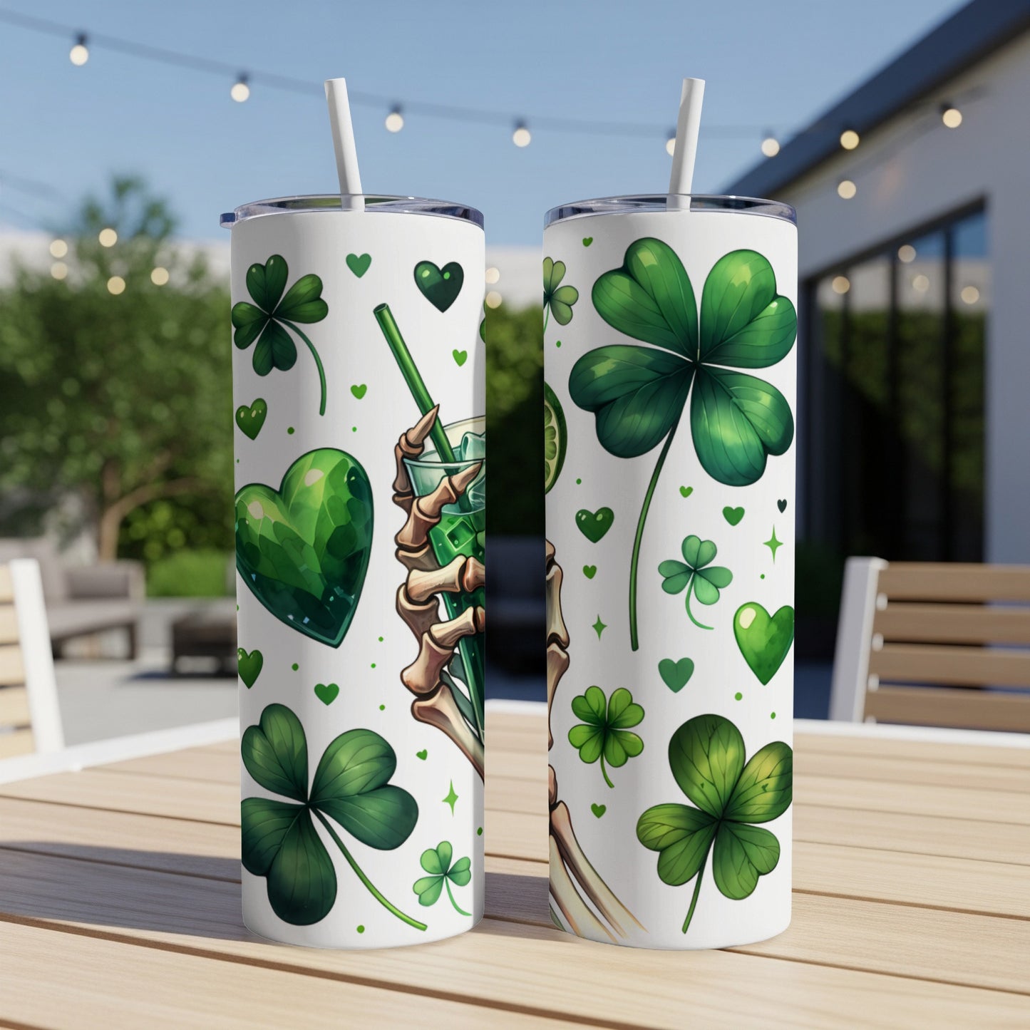 Two St. Patrick's Day tumblers with shamrocks and a skeleton hand holding a drink.