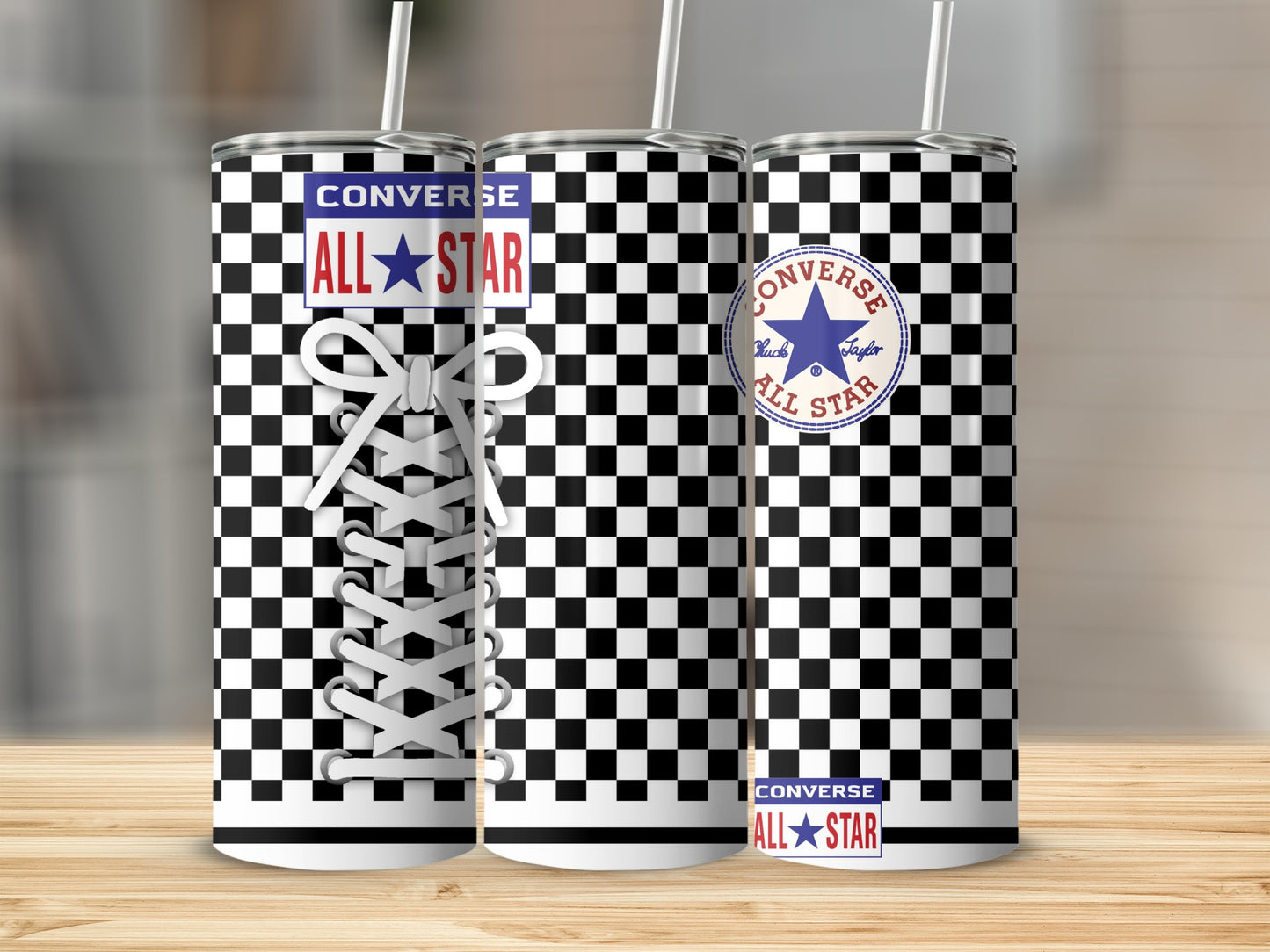 Three Converse all-star tumblers with black and white checkerboard pattern and white laces.