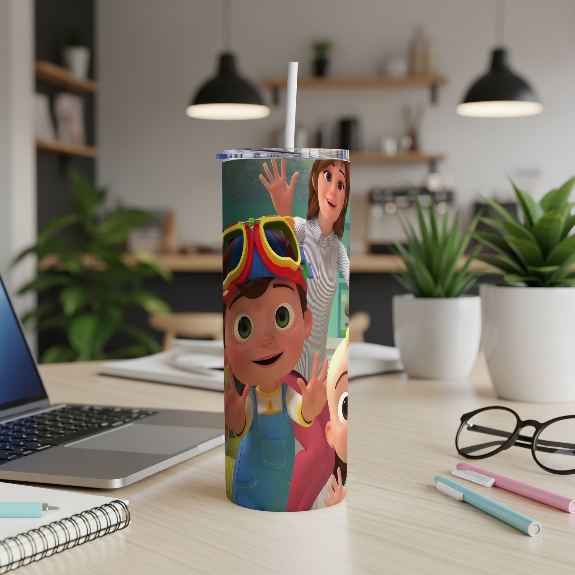 A tumbler featuring CoComelon characters JJ and Cody in front of a blurred kitchen.