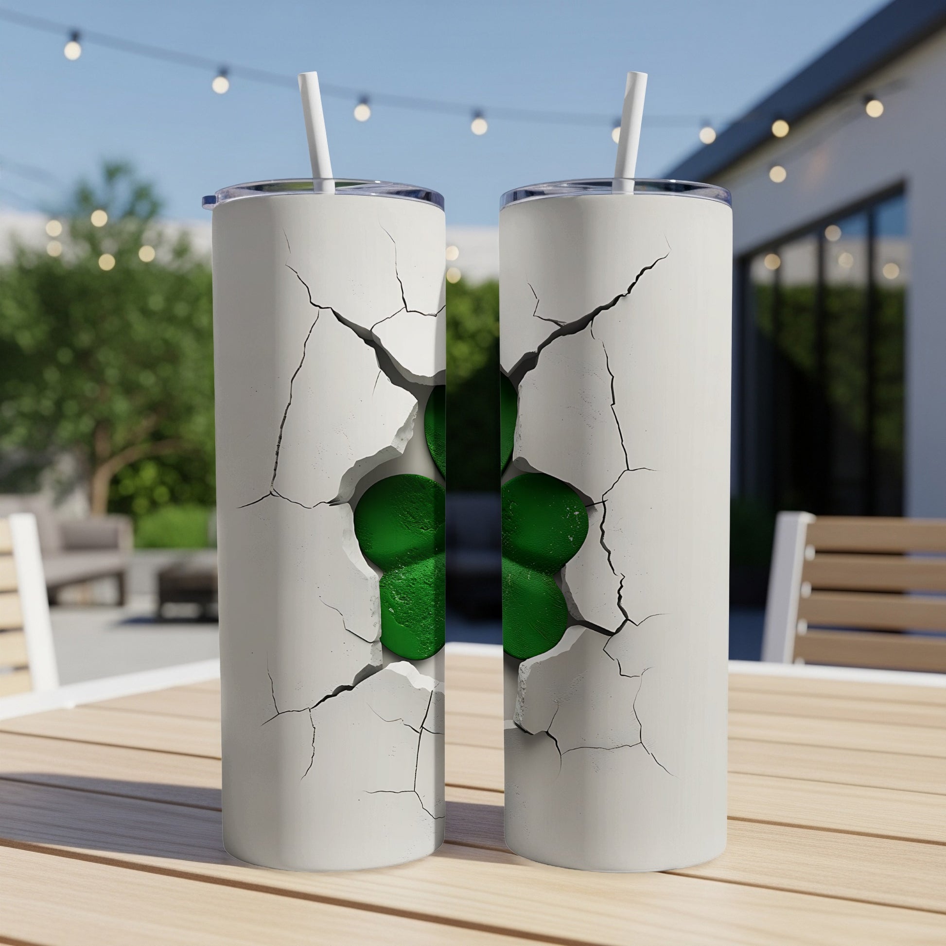 Two white tumblers with a cracked design revealing a green shamrock.