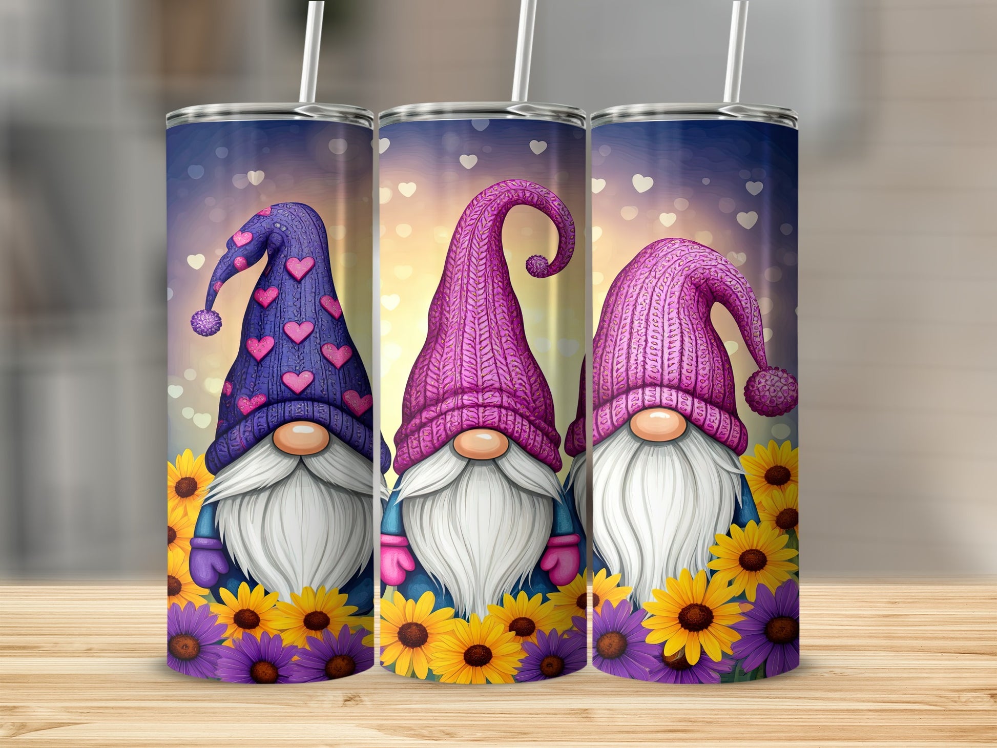 Three gnomes with pink hats and heart patterns stand before sunflowers.