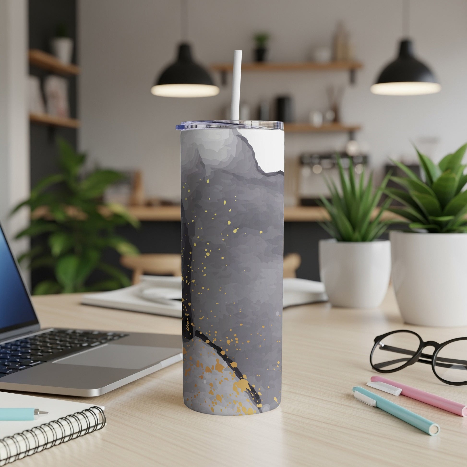 Tumbler with gray, white, and gold abstract watercolor design.