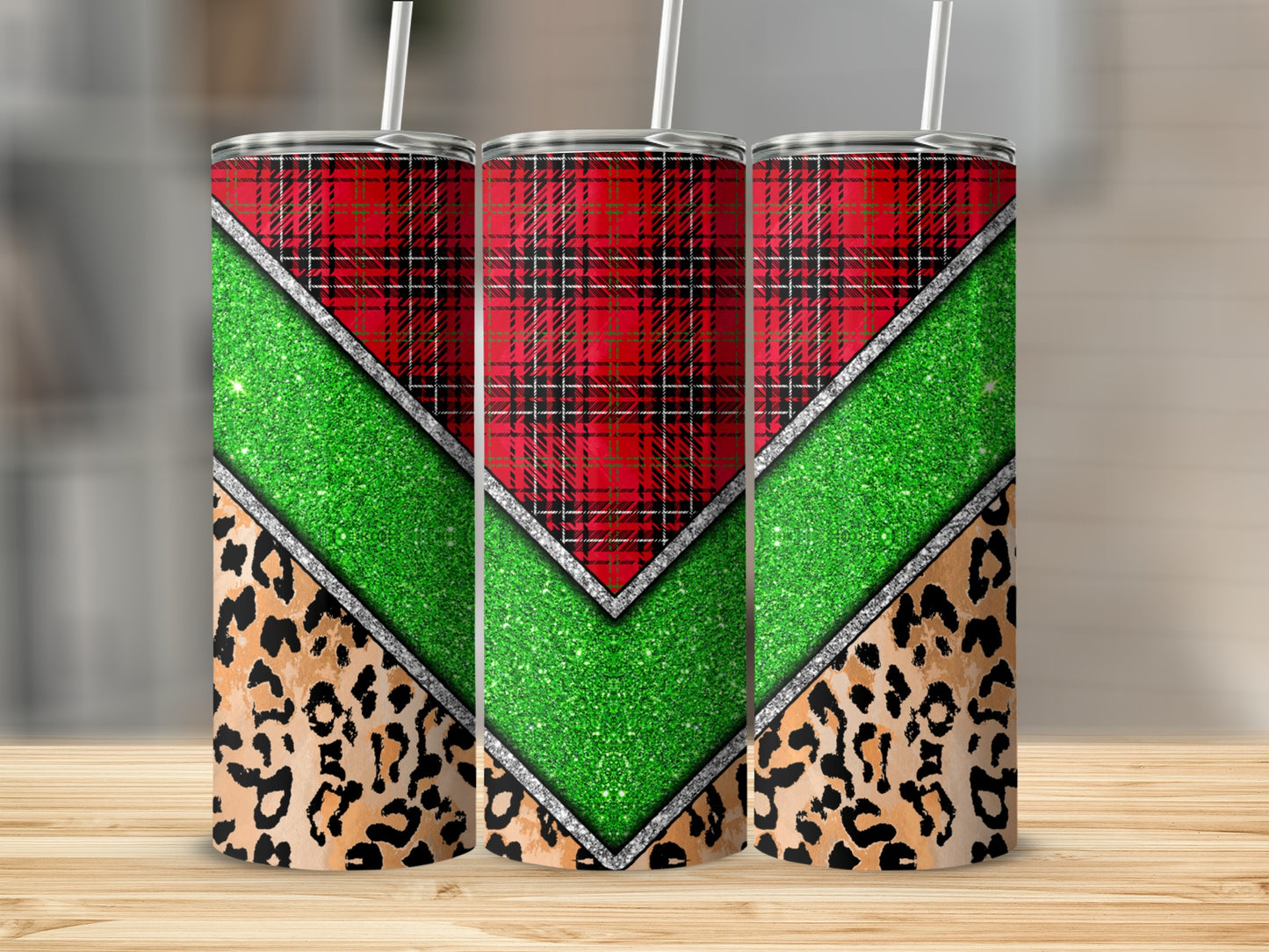 Three tumblers with red plaid, green glitter, and leopard print designs.