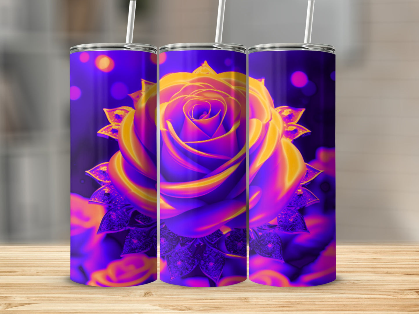 Purple and orange rose design on three tumblers with bokeh background.