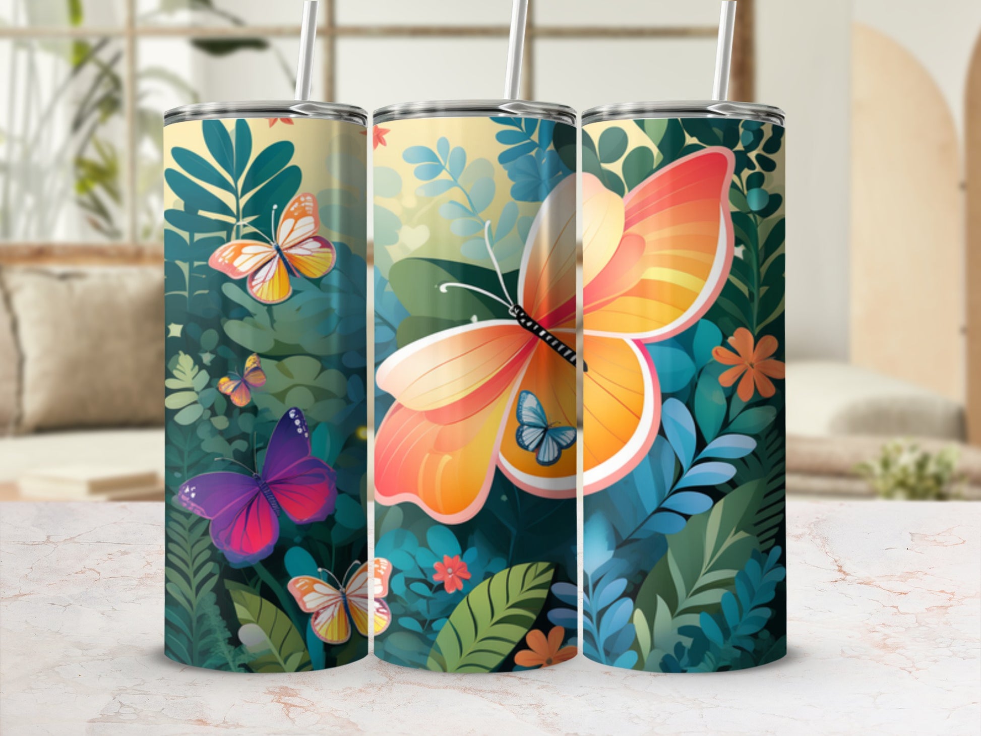 Three tumblers with colorful butterflies and floral designs.