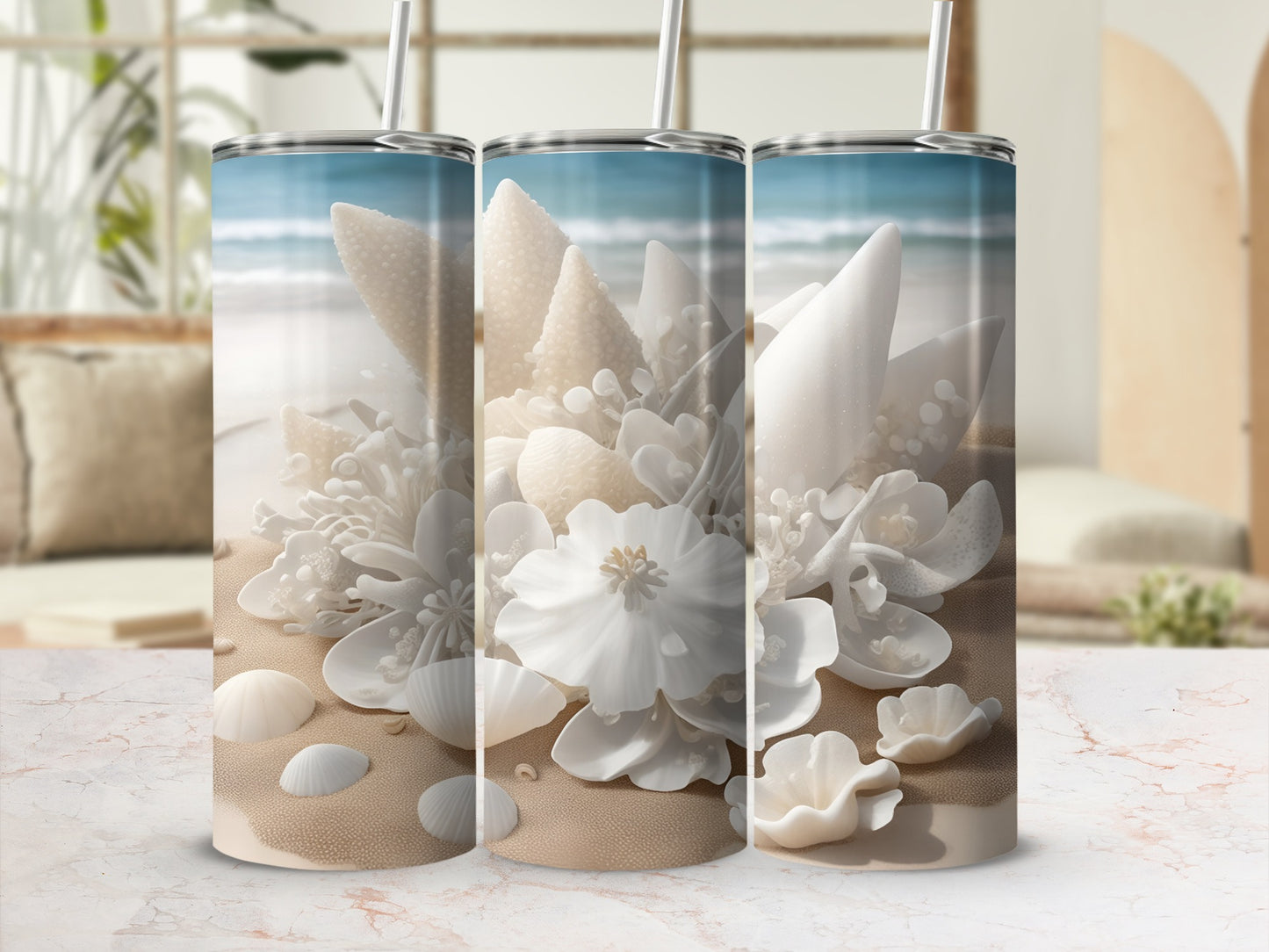 Three tumblers with a beach-themed design of shells and flowers.