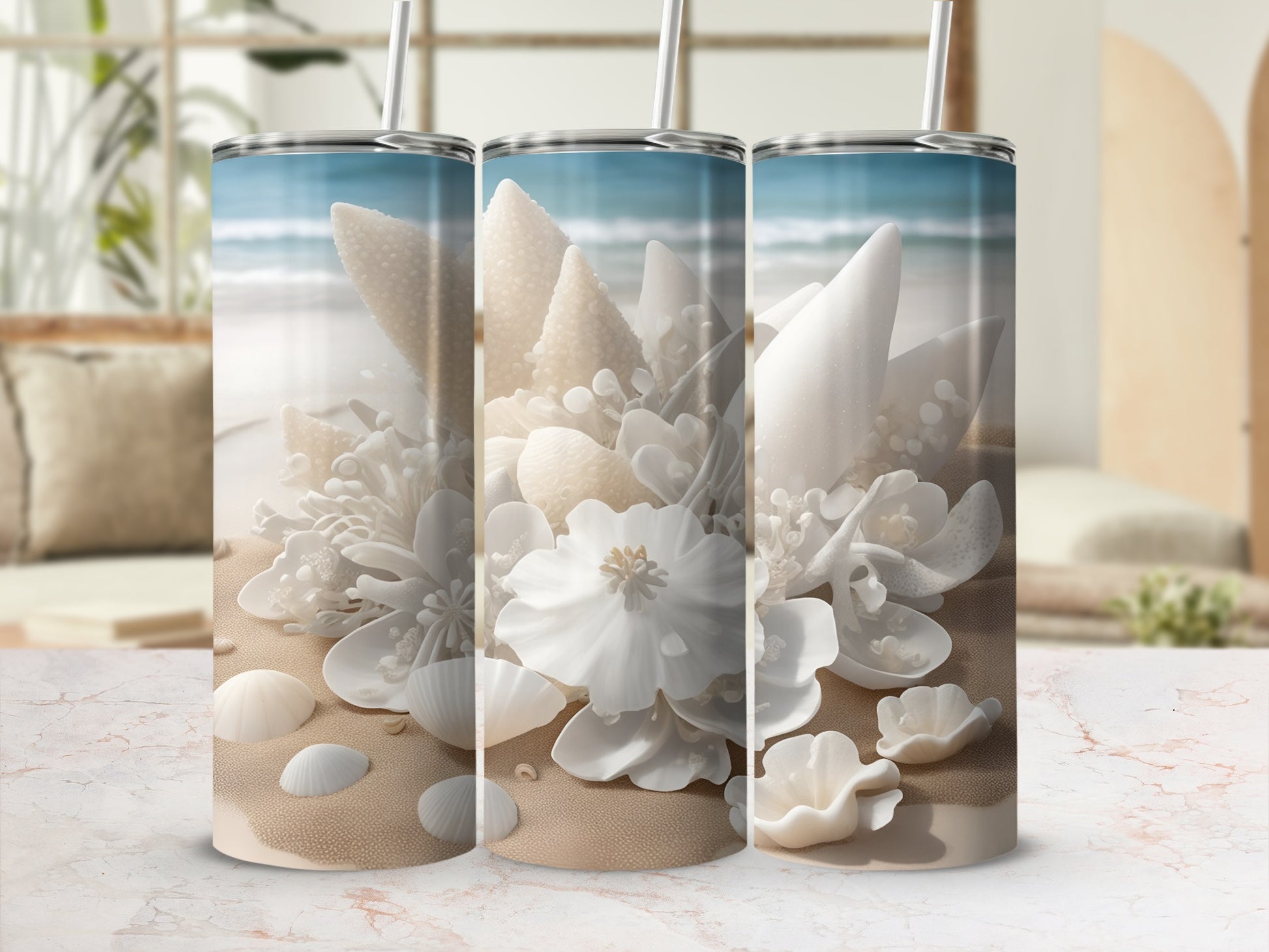 Three tumblers with a beach-themed design of shells and flowers.