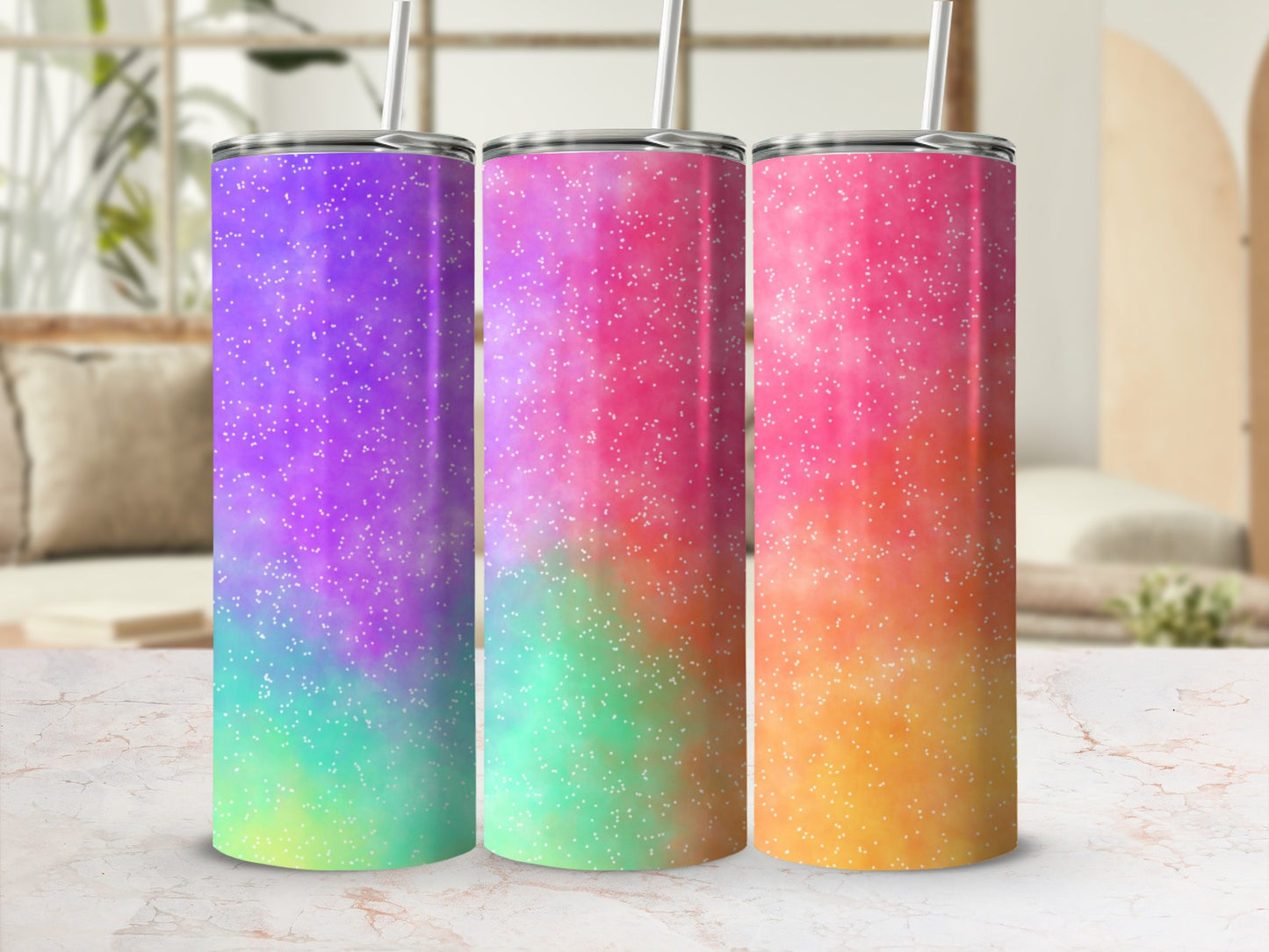 Three tumblers with glitter gradient designs in purple, pink, and orange.